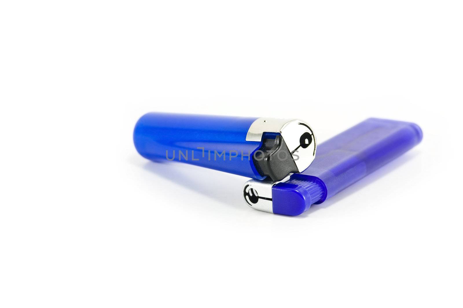 Two blue plastic lighters on white by ChrisAlleaume