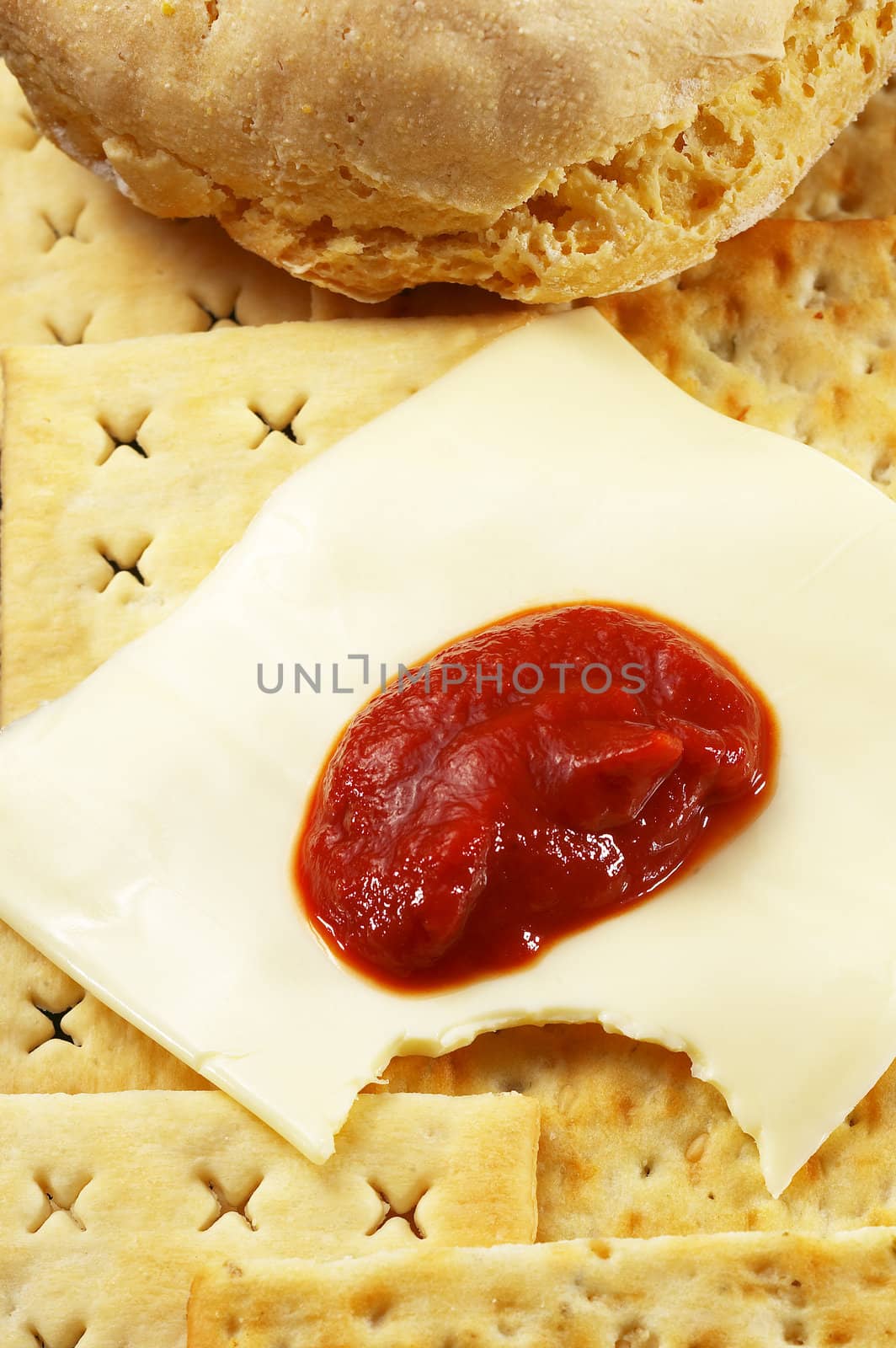 bread ,crackers and cheese with tomato sauce