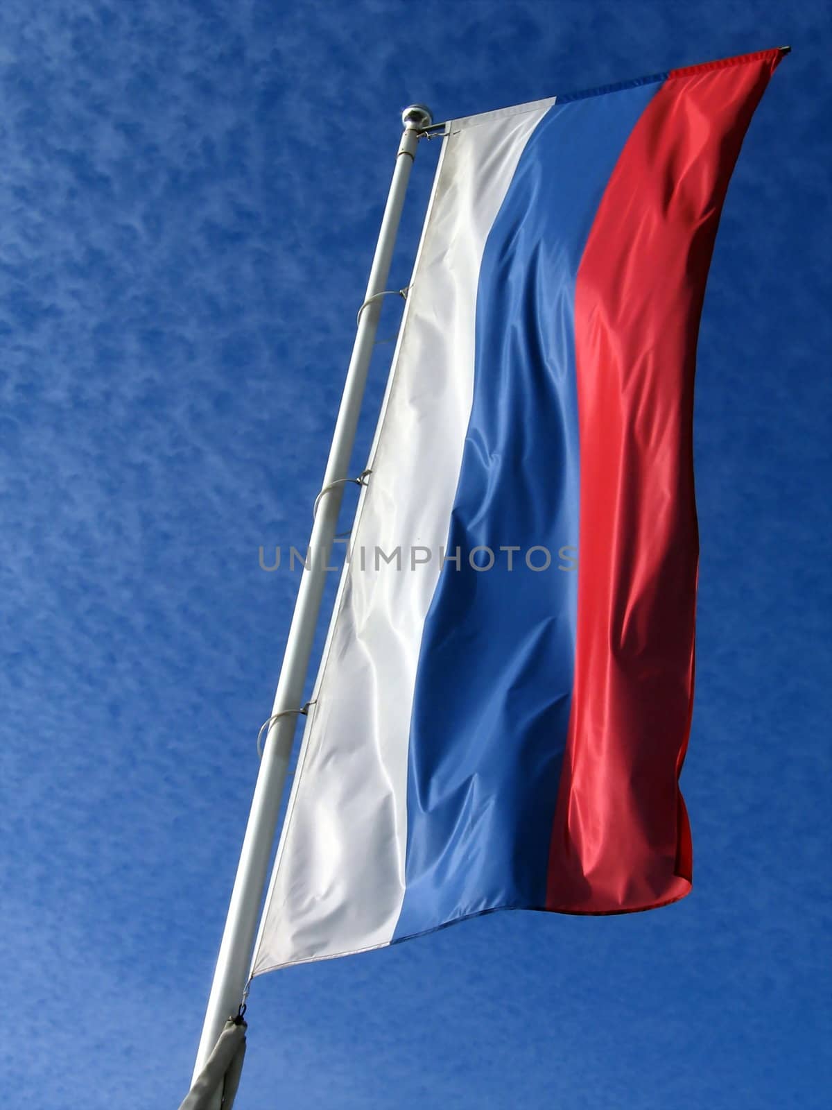 National Russian flag on a background of blue sky