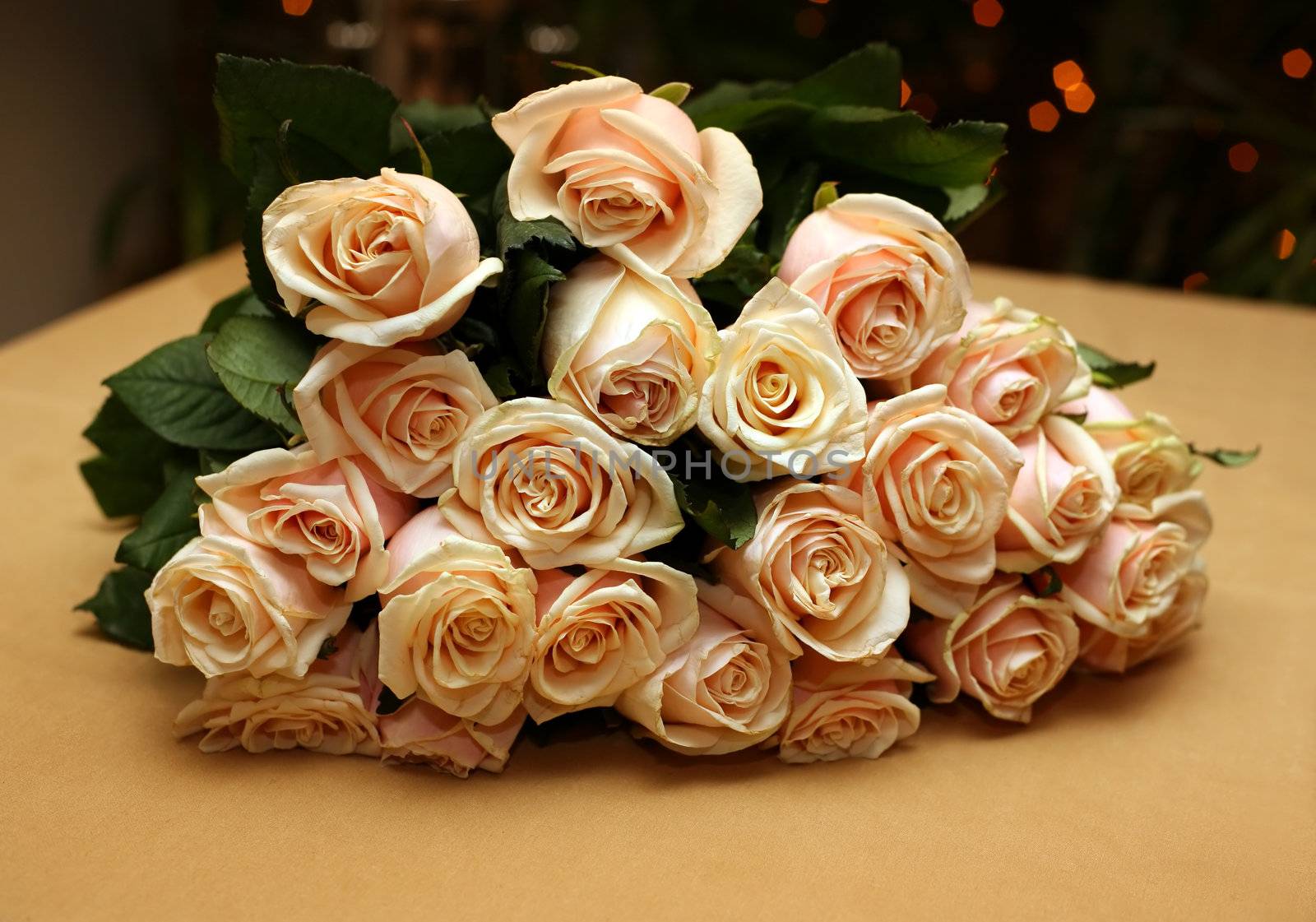 Bunch of fresh roses on a table in an interior of restaurant