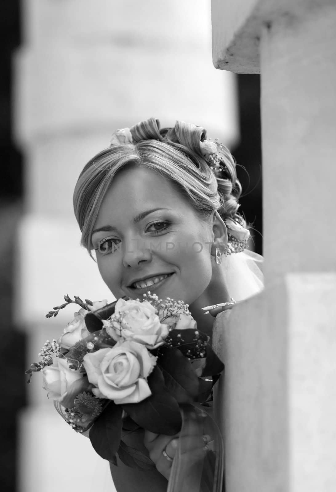 Portrait of the beautiful bride with a bouquet