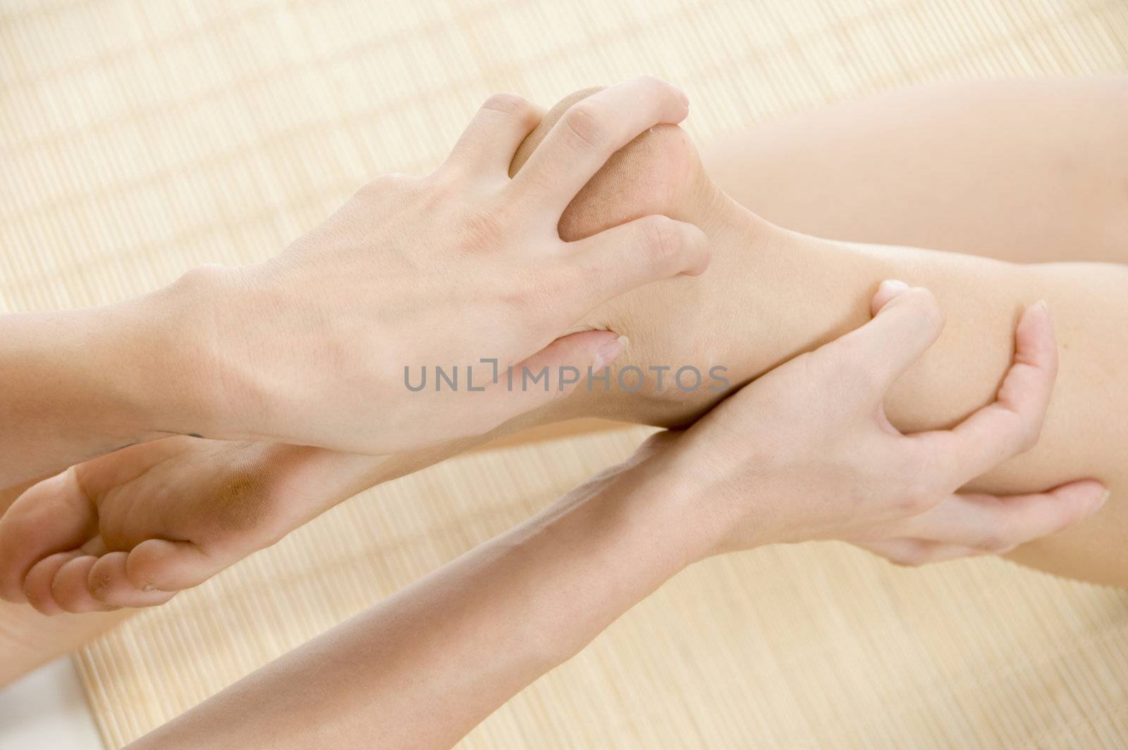 lady getting feet massage on an isolated background