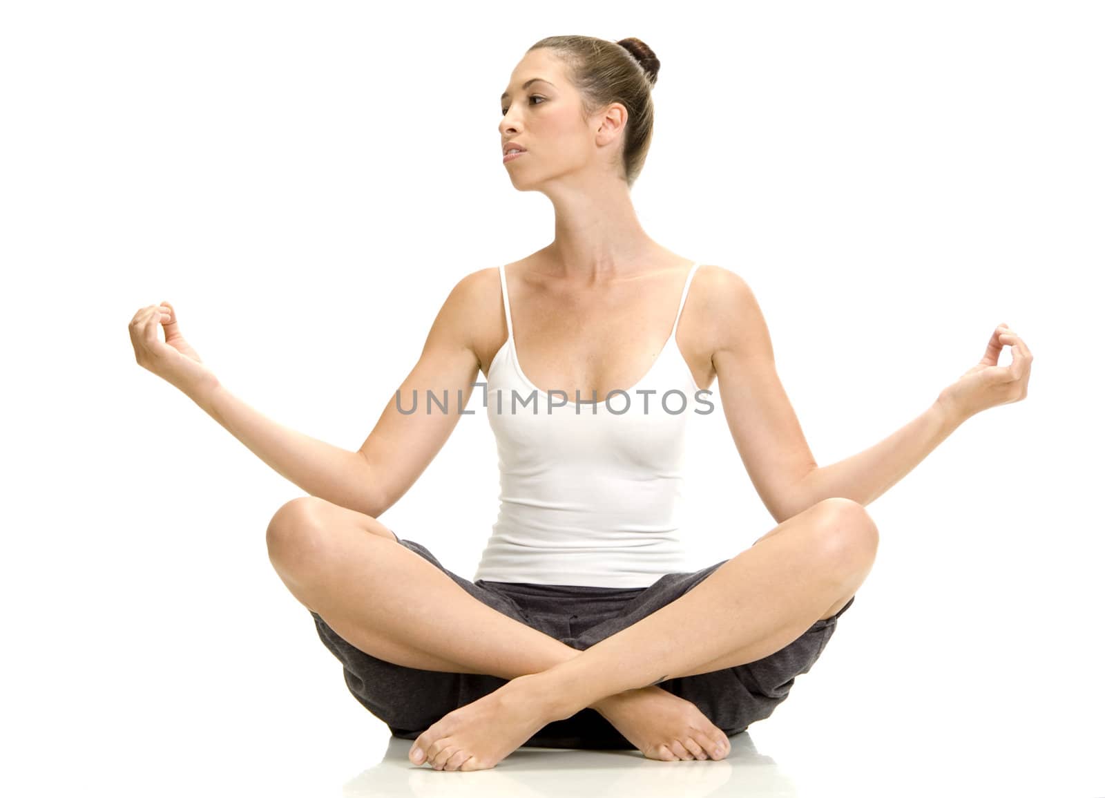 woman in lotus pose and looking sideways