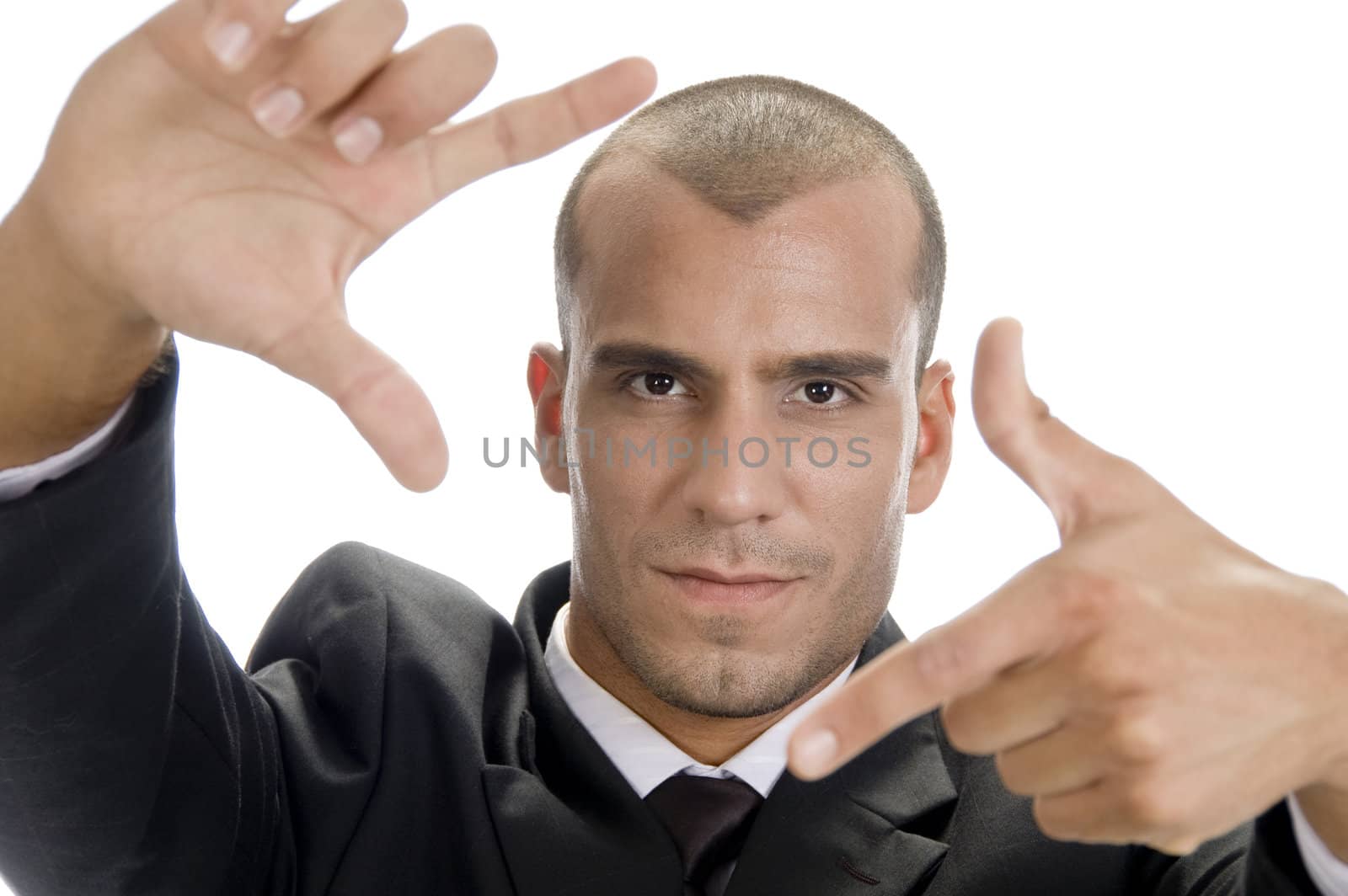 young man making frame with hand gesture on an isolated white background