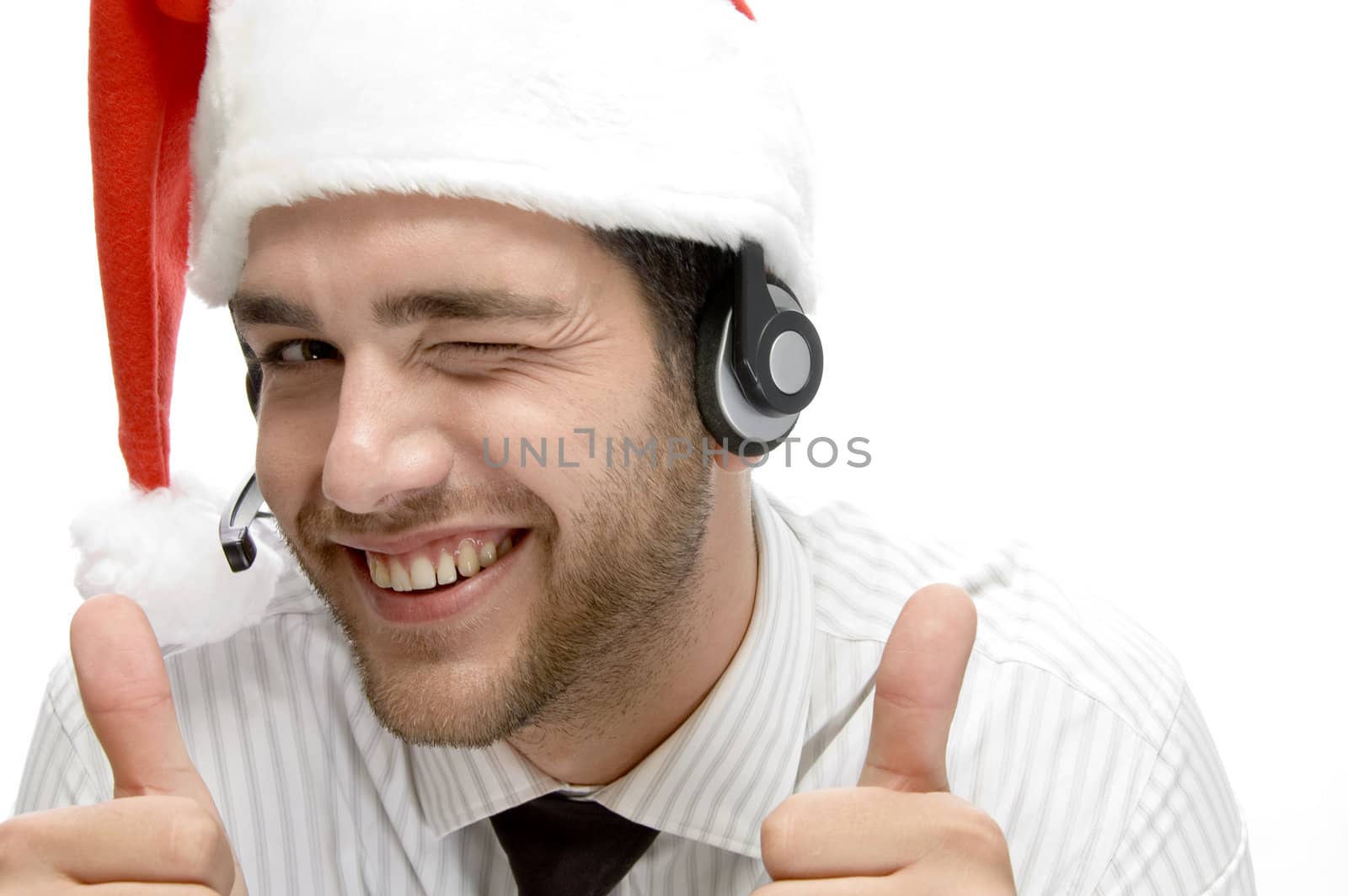 happy businessman posing with cheer up and wearing santa cap