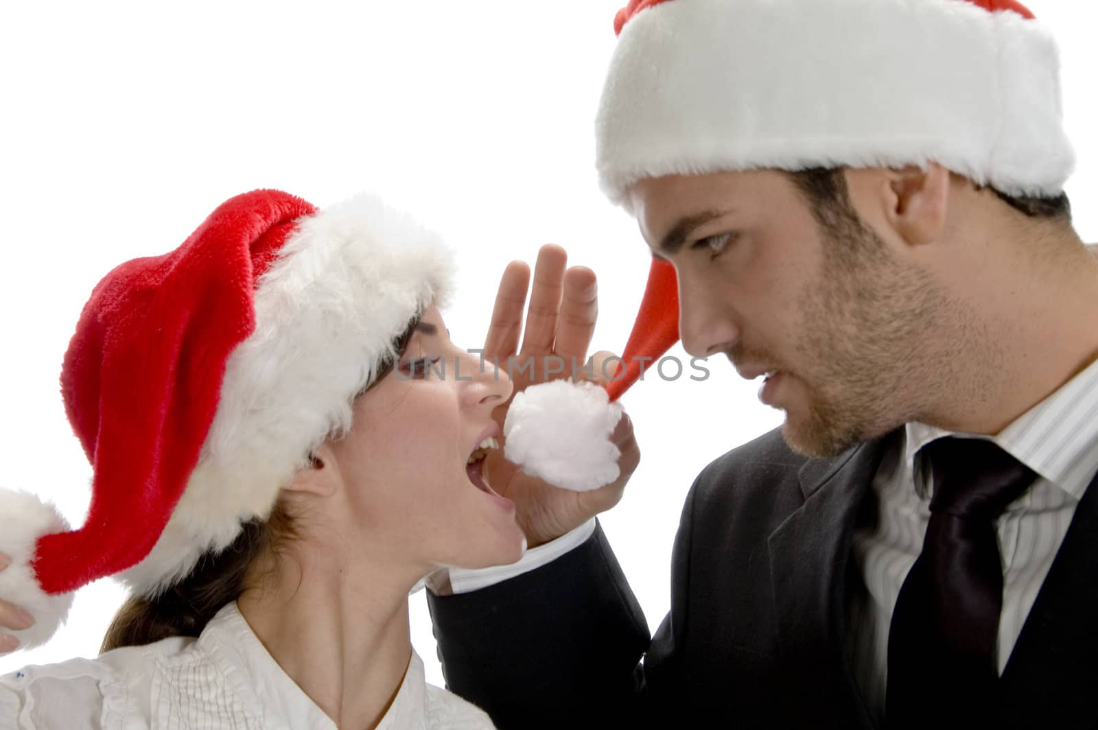 happy couple with red santa cap isolated on white background