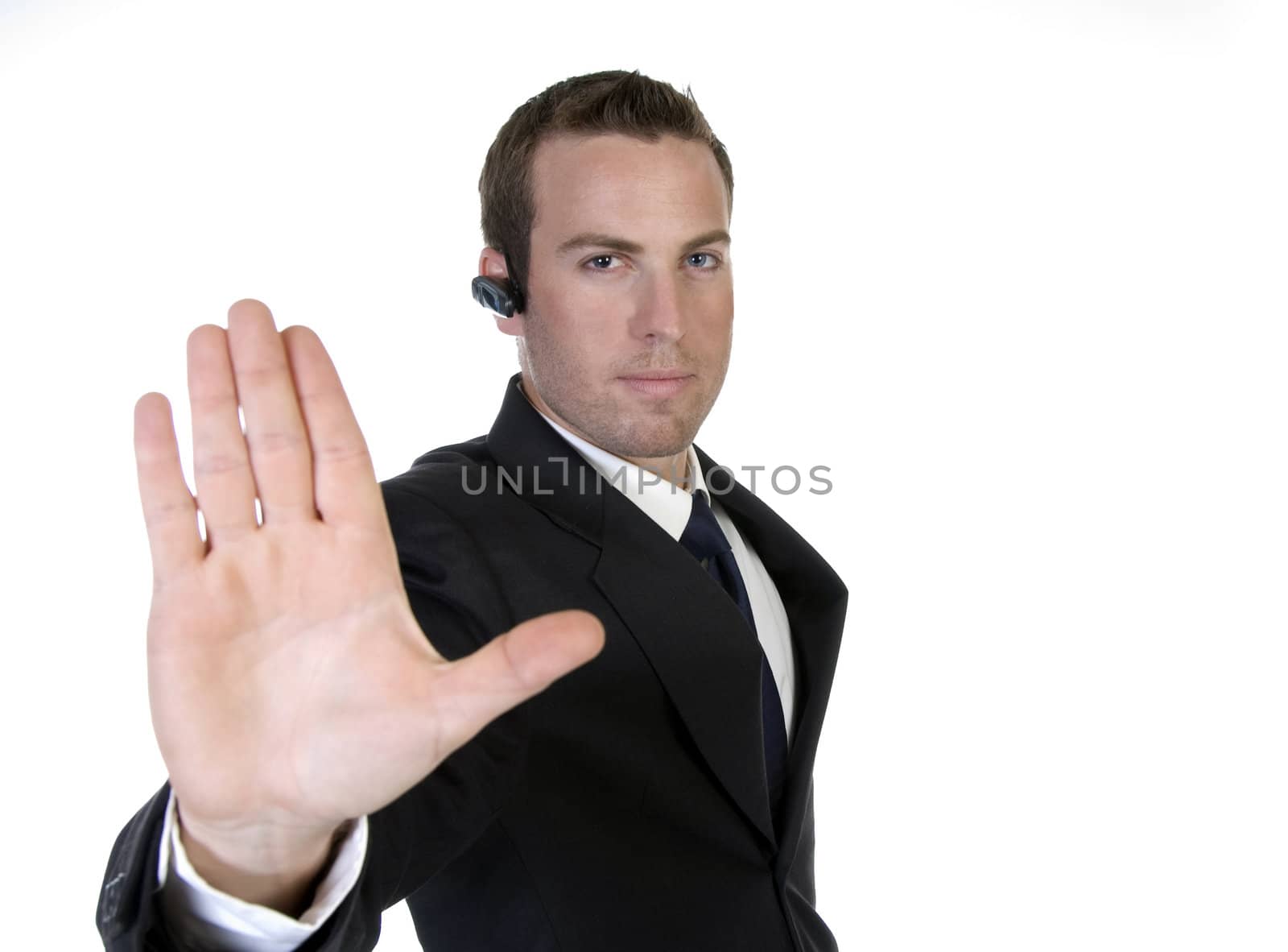 businessman holding hand out in protest with white background