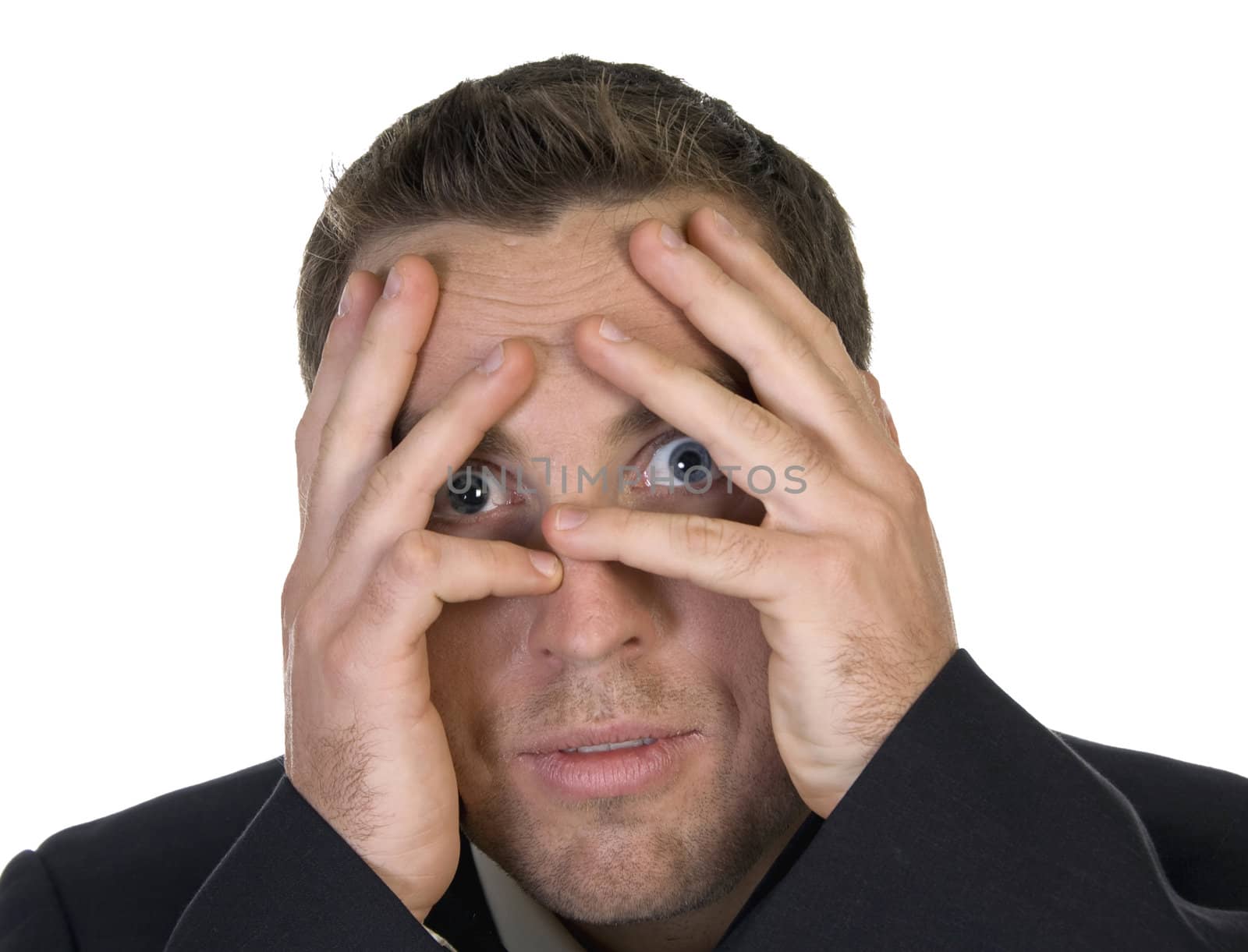 businessman peeking behind his hand against white background