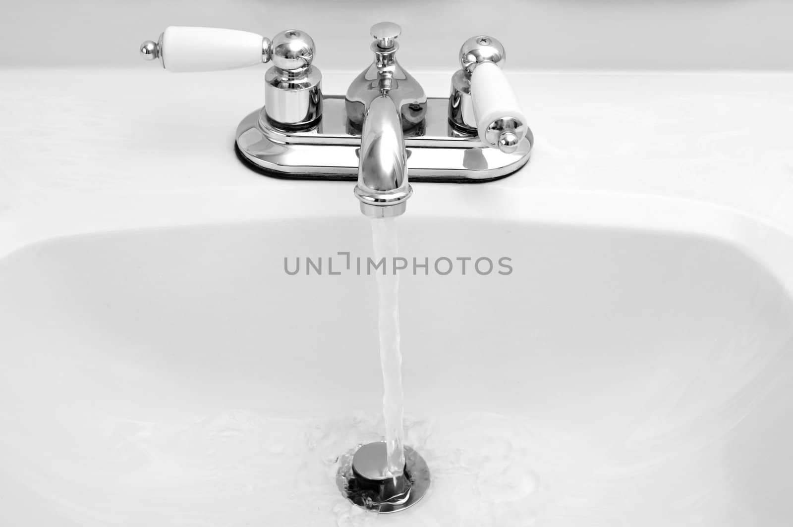 potable sink running water, black and white