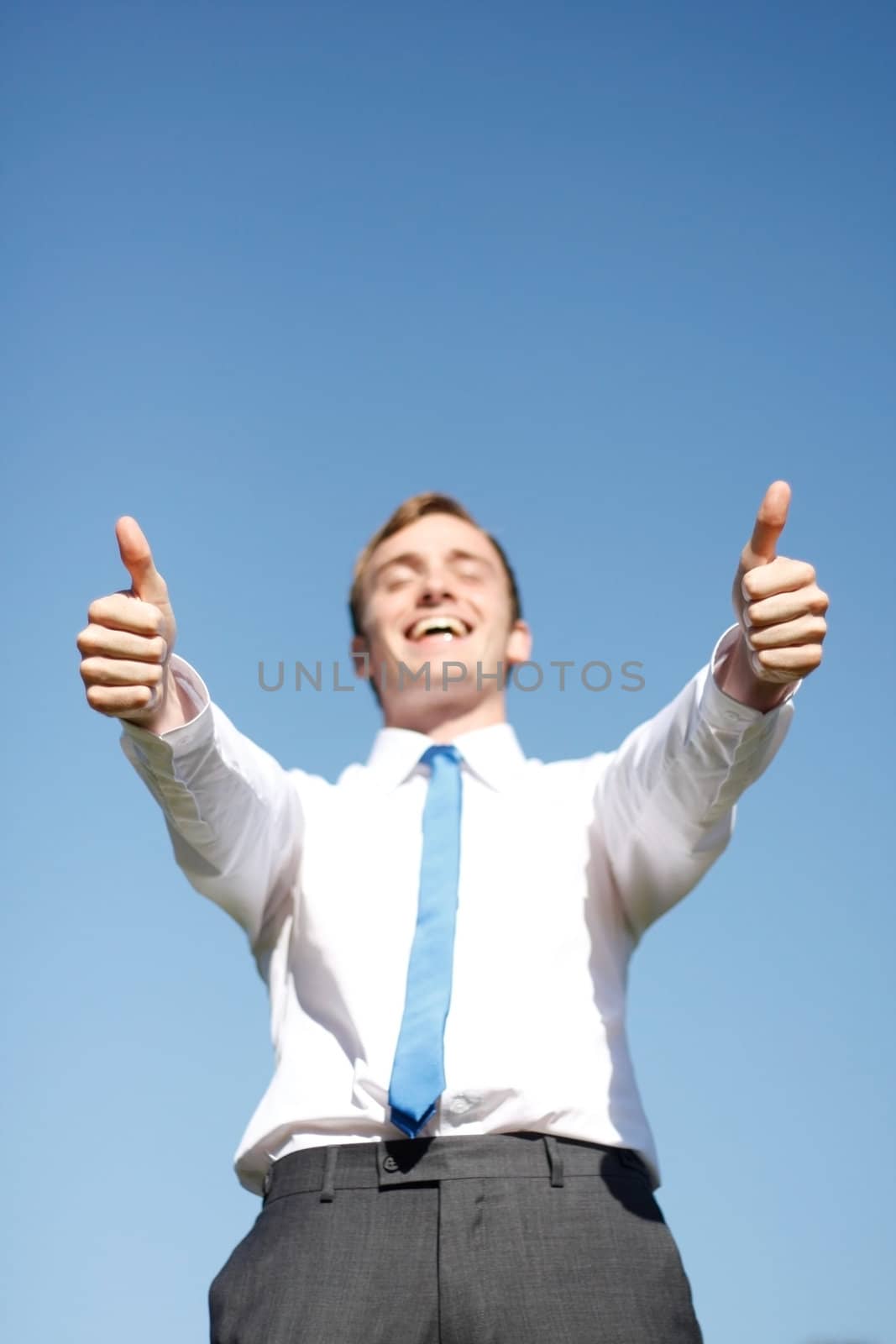A business man giving thumbs up