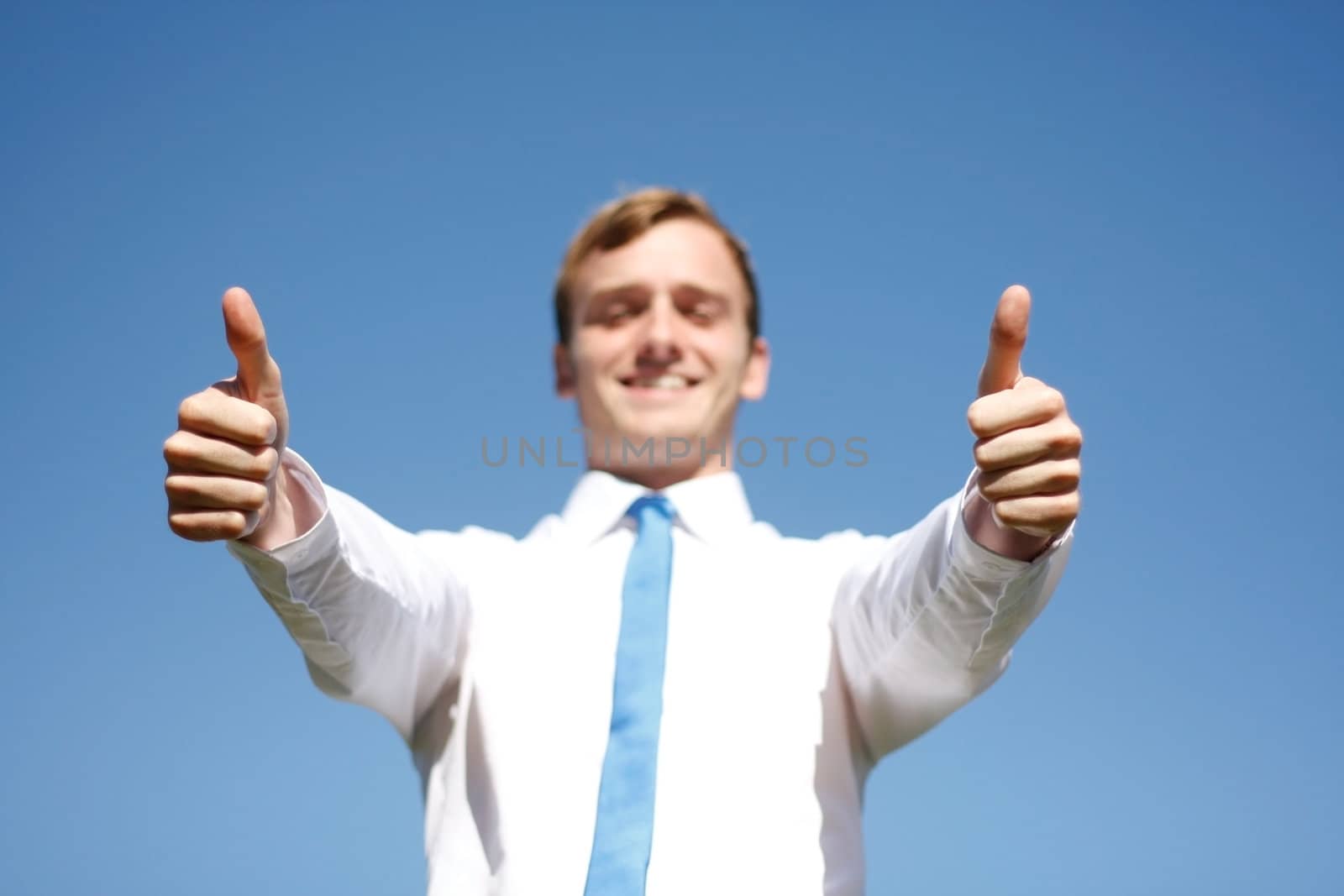 A business man giving thumbs up