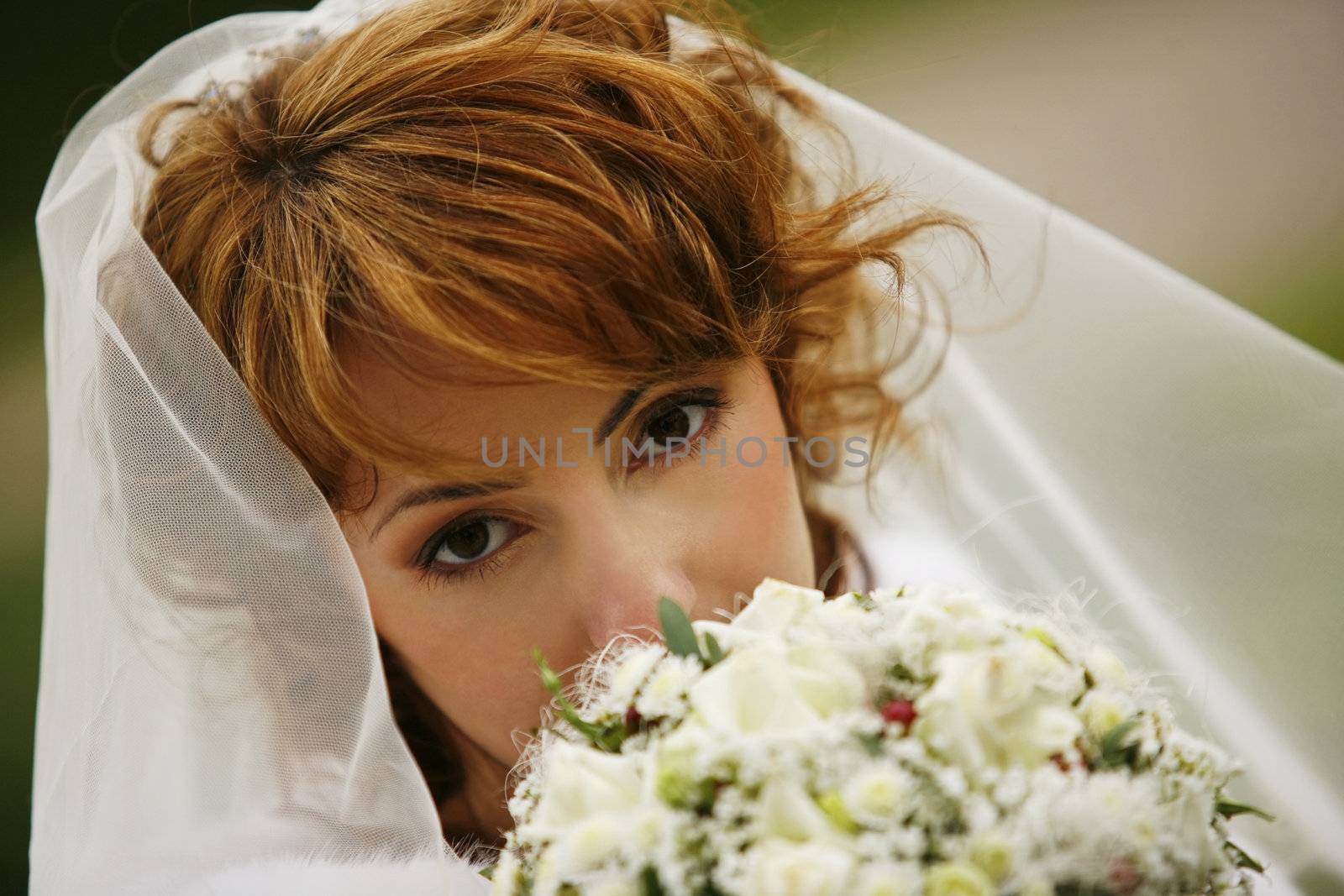 Portrait of the beautiful bride with a bouquet