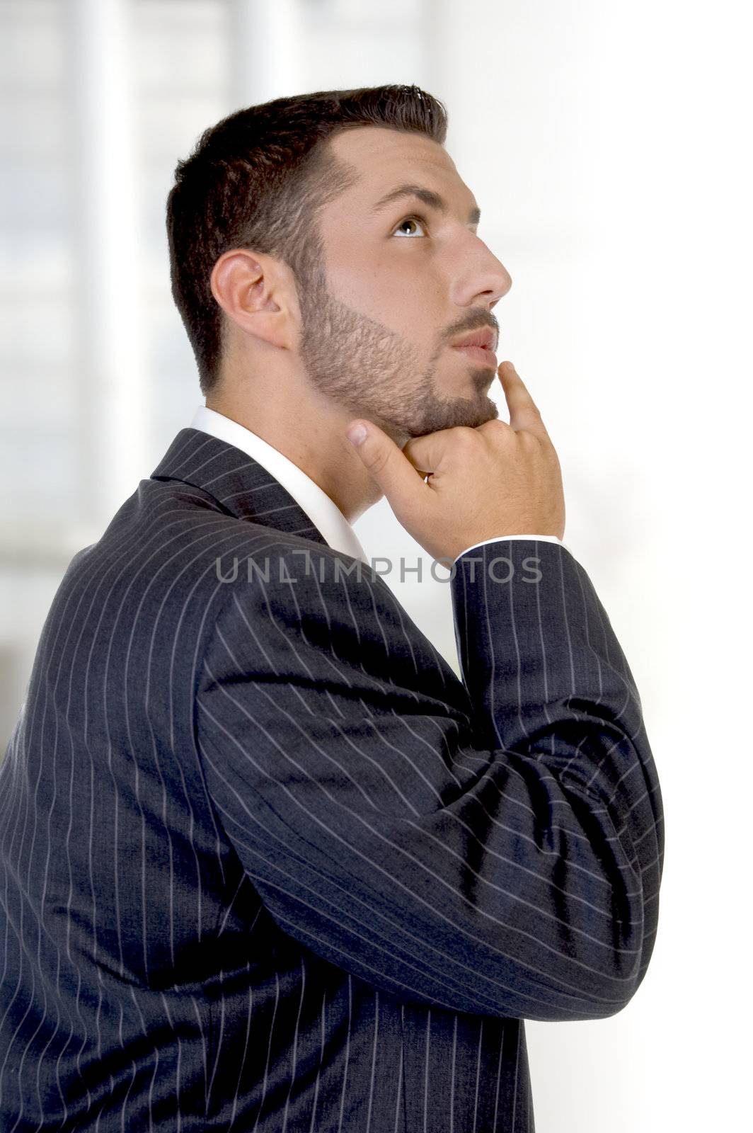 thinking young executive on an abstract background