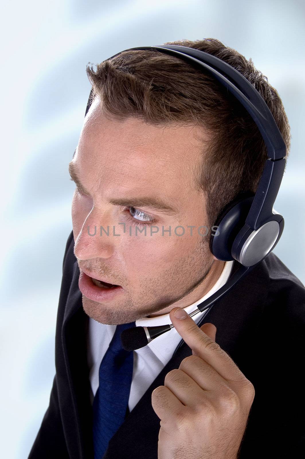potrait young businessman with headphones by imagerymajestic