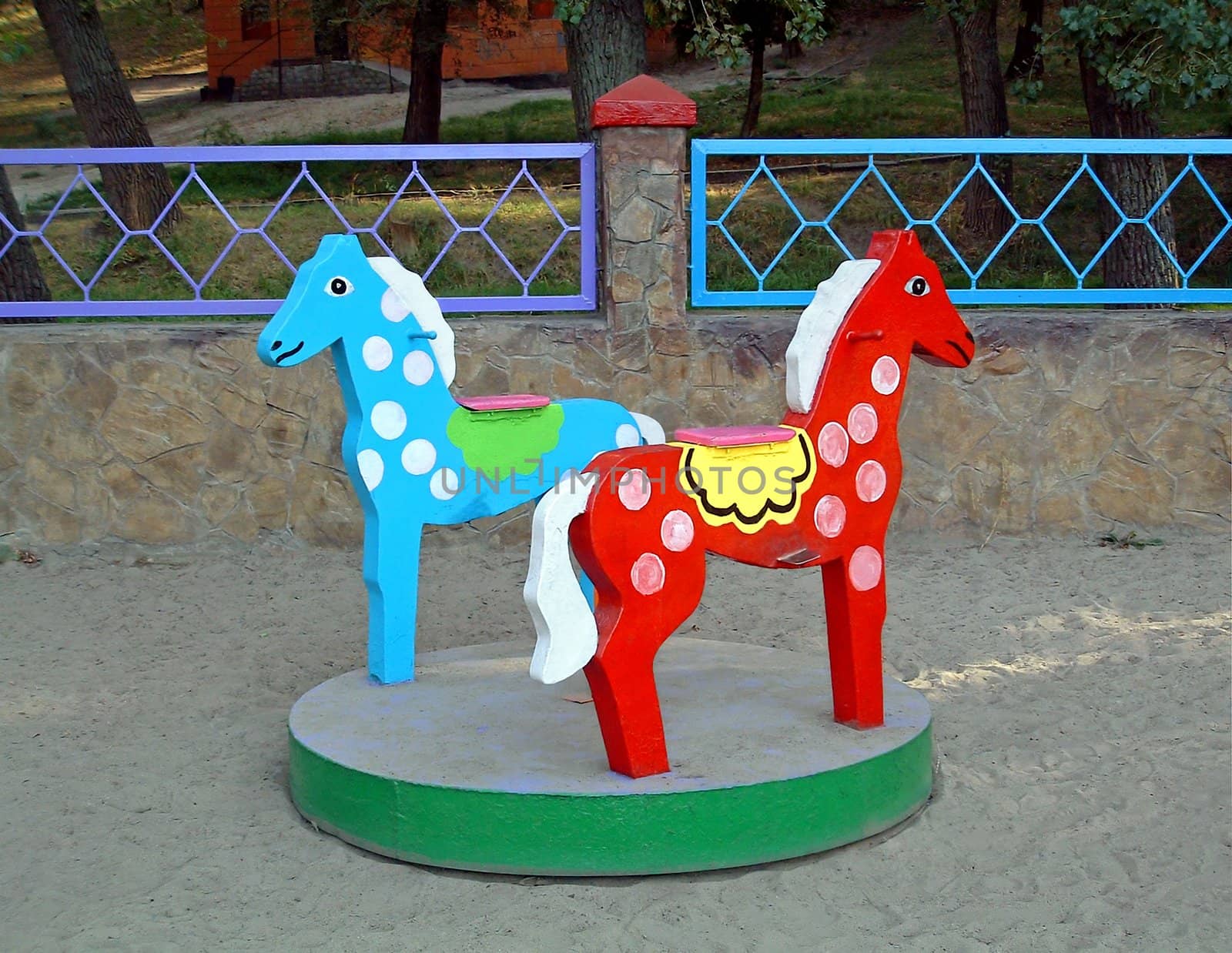Children's amusement which is actuated by hands and rotates about the axis. A playground in park for children of 1-5 years.