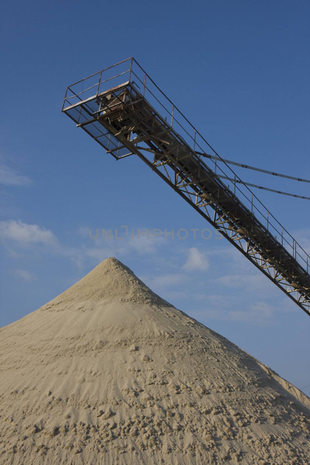 belt conveyor and a heap of gravel by bernjuer