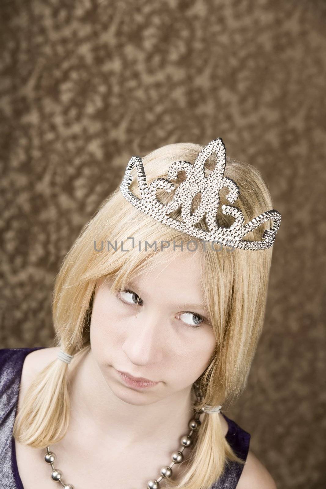 Portrait of pretty young girl wearing a tiara