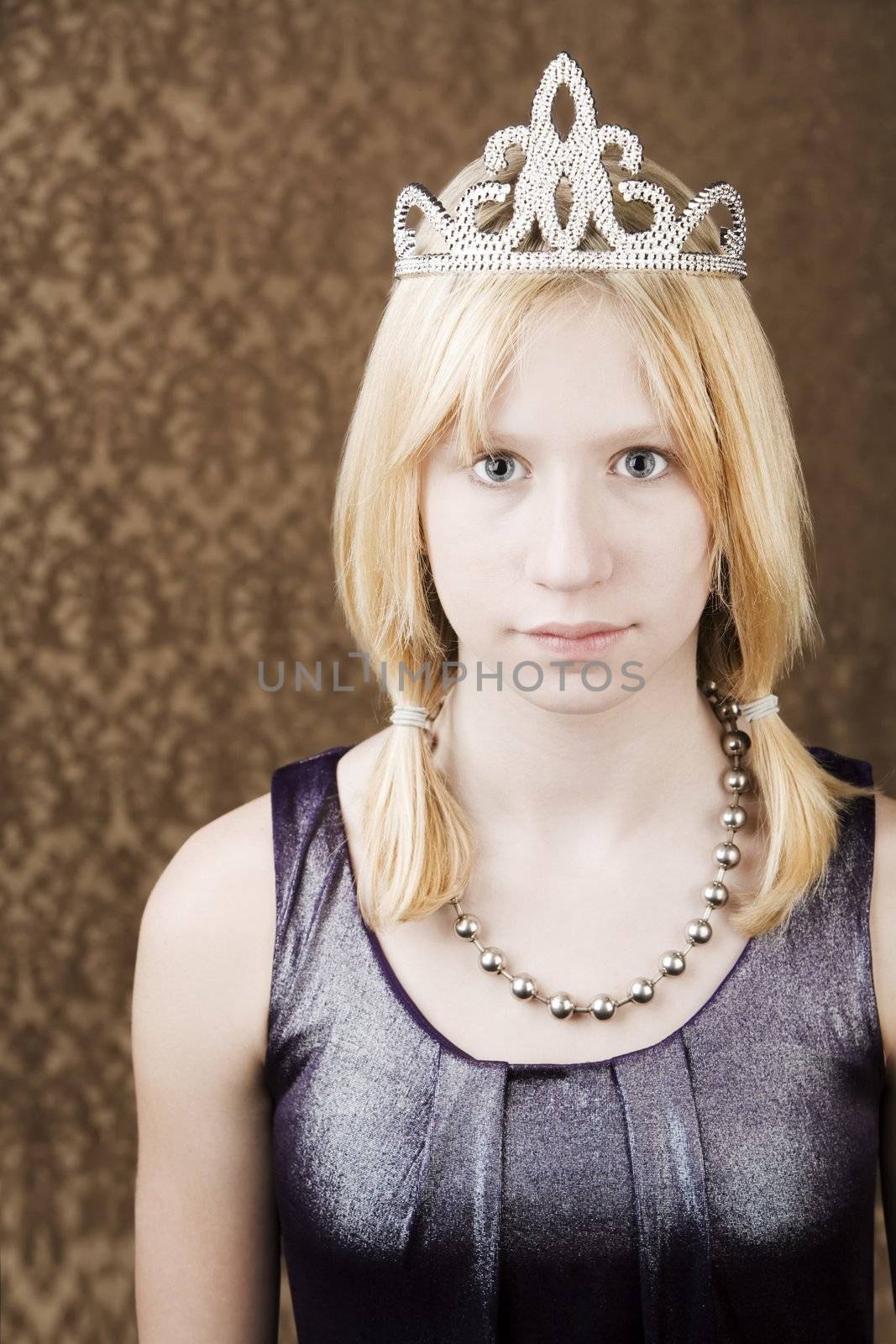 Portrait of pretty young girl wearing a tiara
