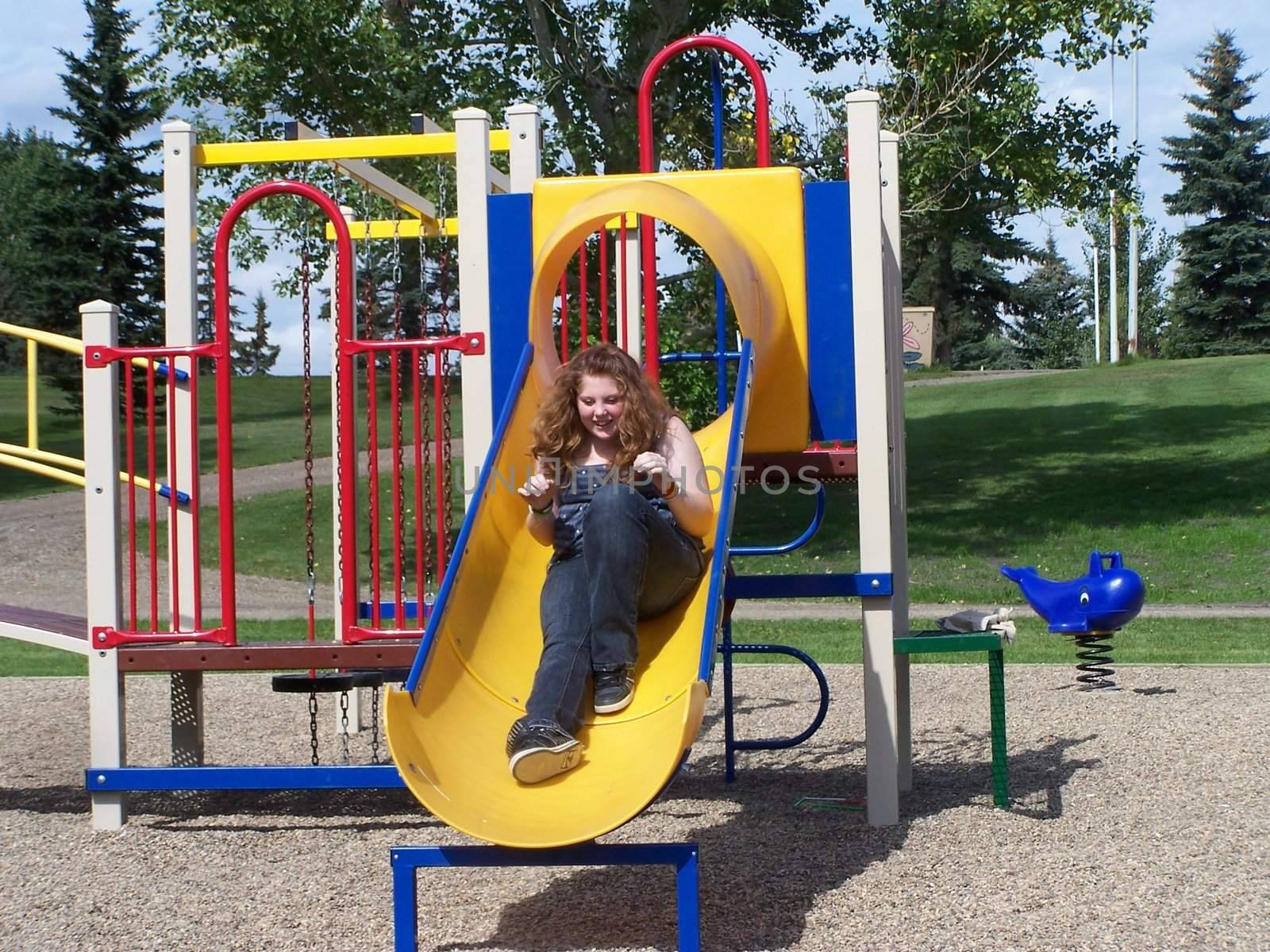 children on playground slide