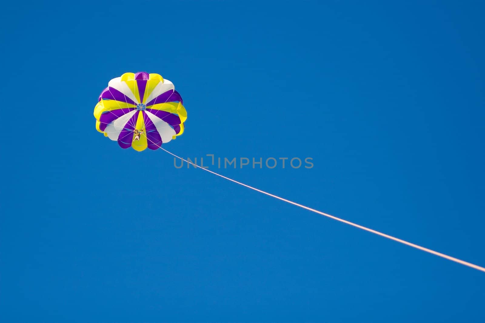 Parachute in the sky tether by cord