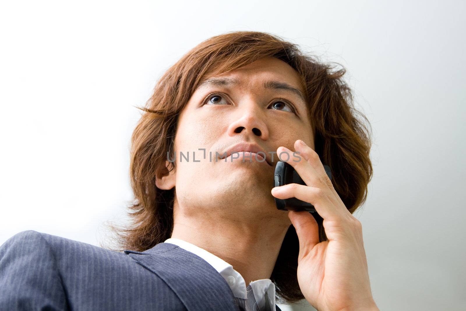 Asian business man and phone by phakimata