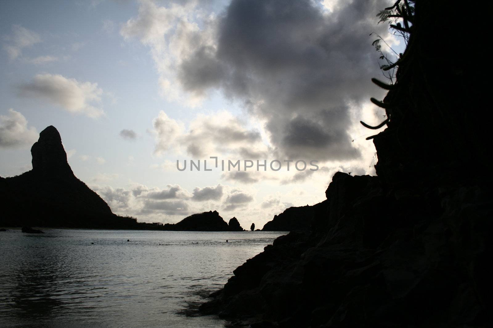 The silhouette of rock in Fernando de Noronha, at sun down.