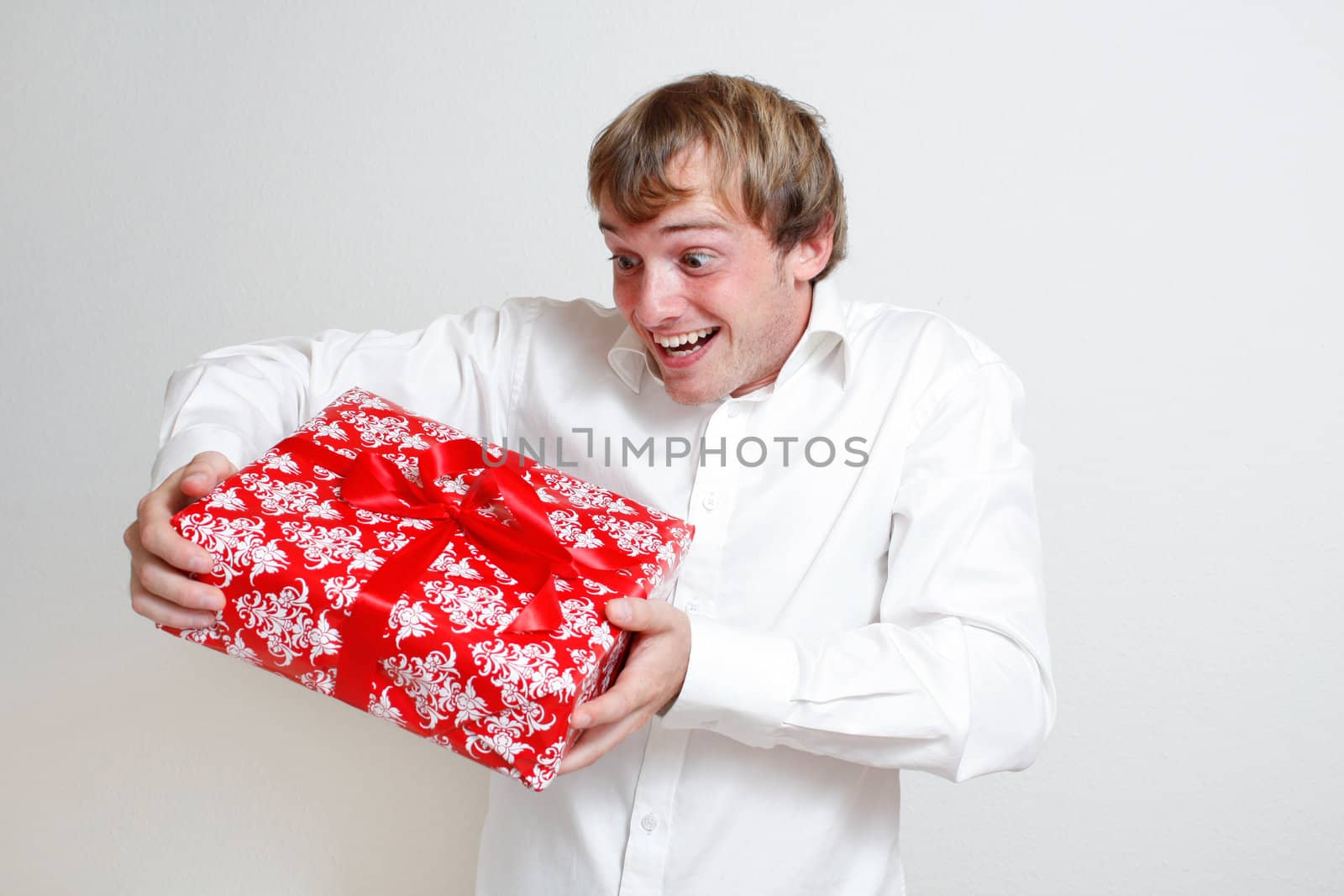 A man presenting a christmas present