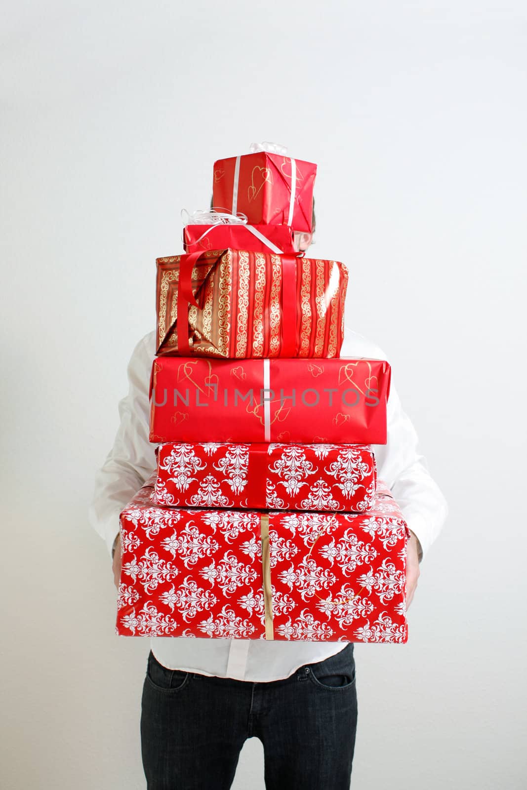 A man presenting several christmas presents