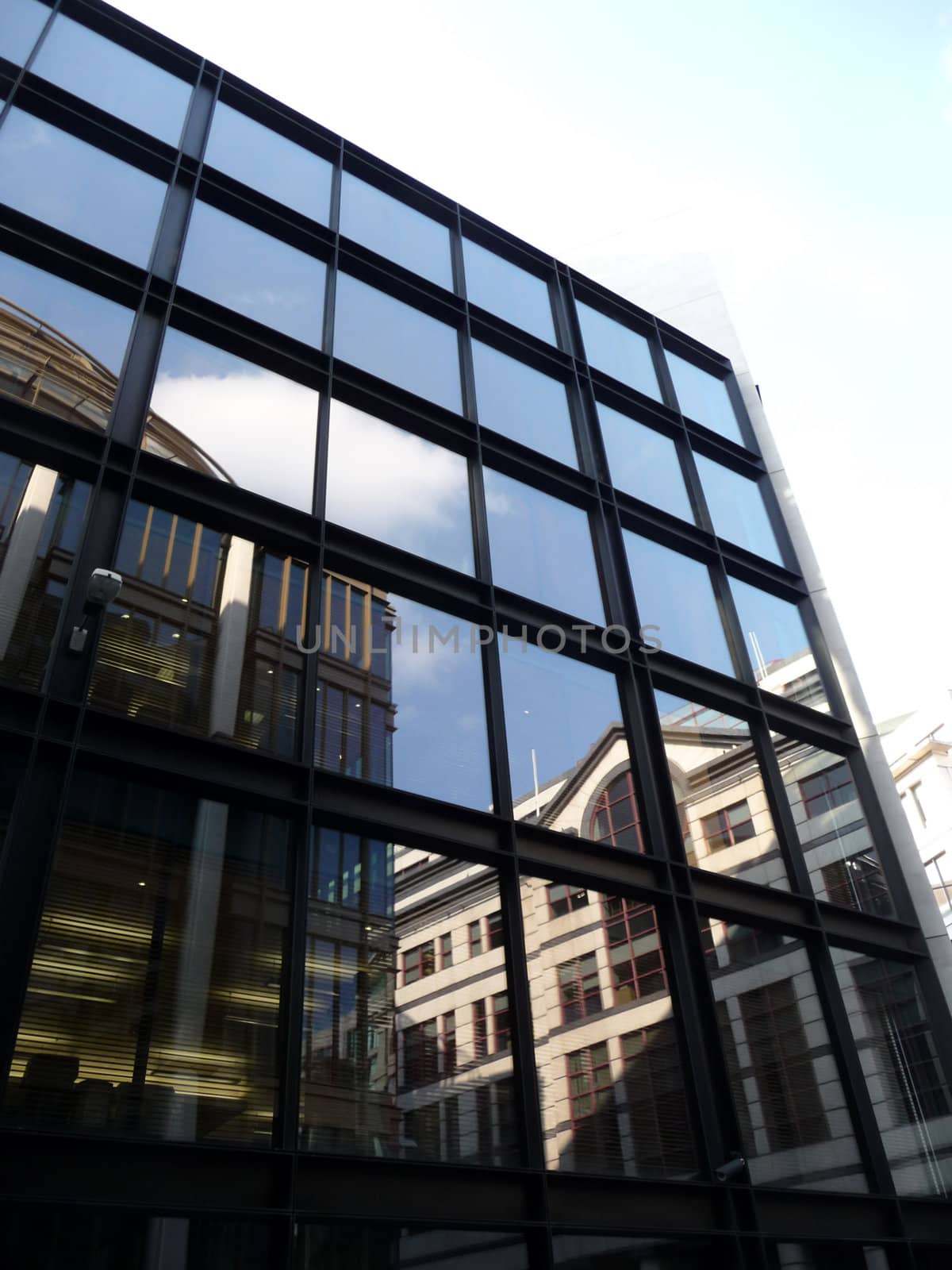A set of reflective windows on an office building.