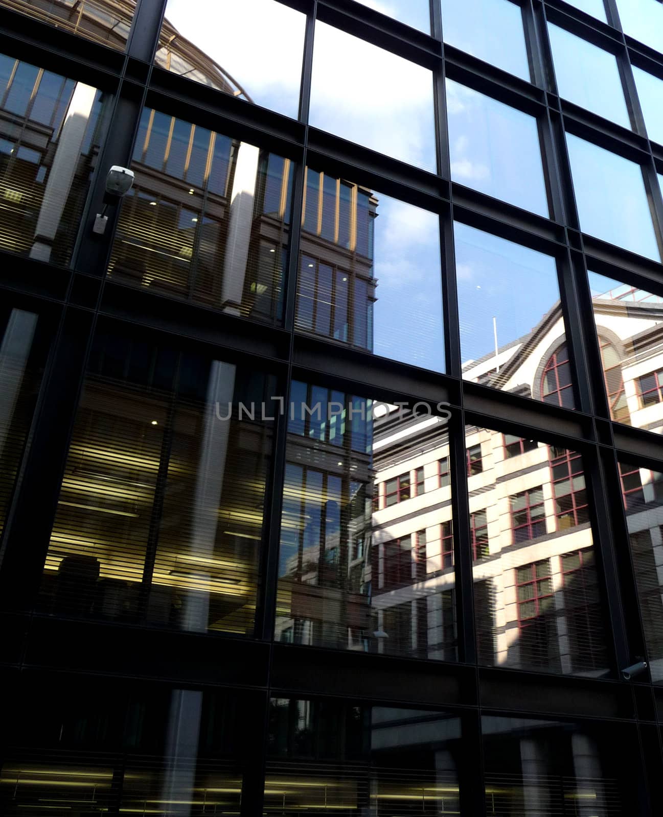 A set of reflective windows on an office building.