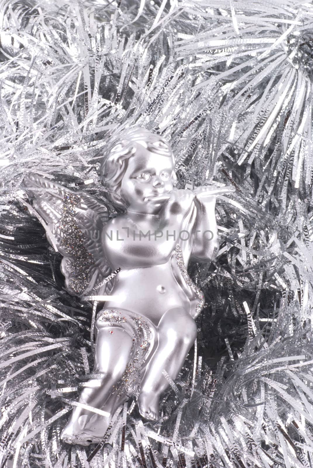 Close up of a little silver angel christmas ornament.