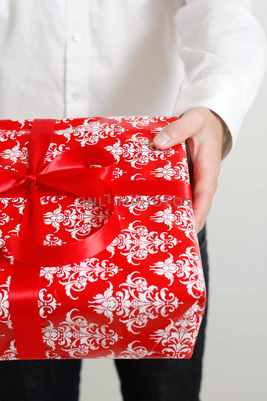 A man presenting a christmas present