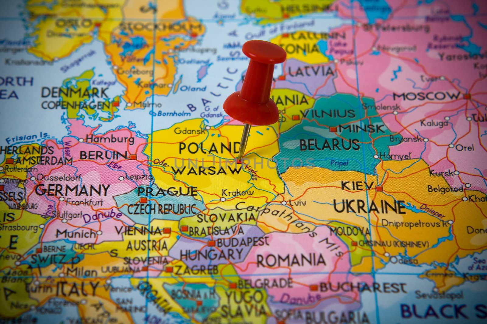Small pin pointing on Warsaw (Poland)  in a map of Europe