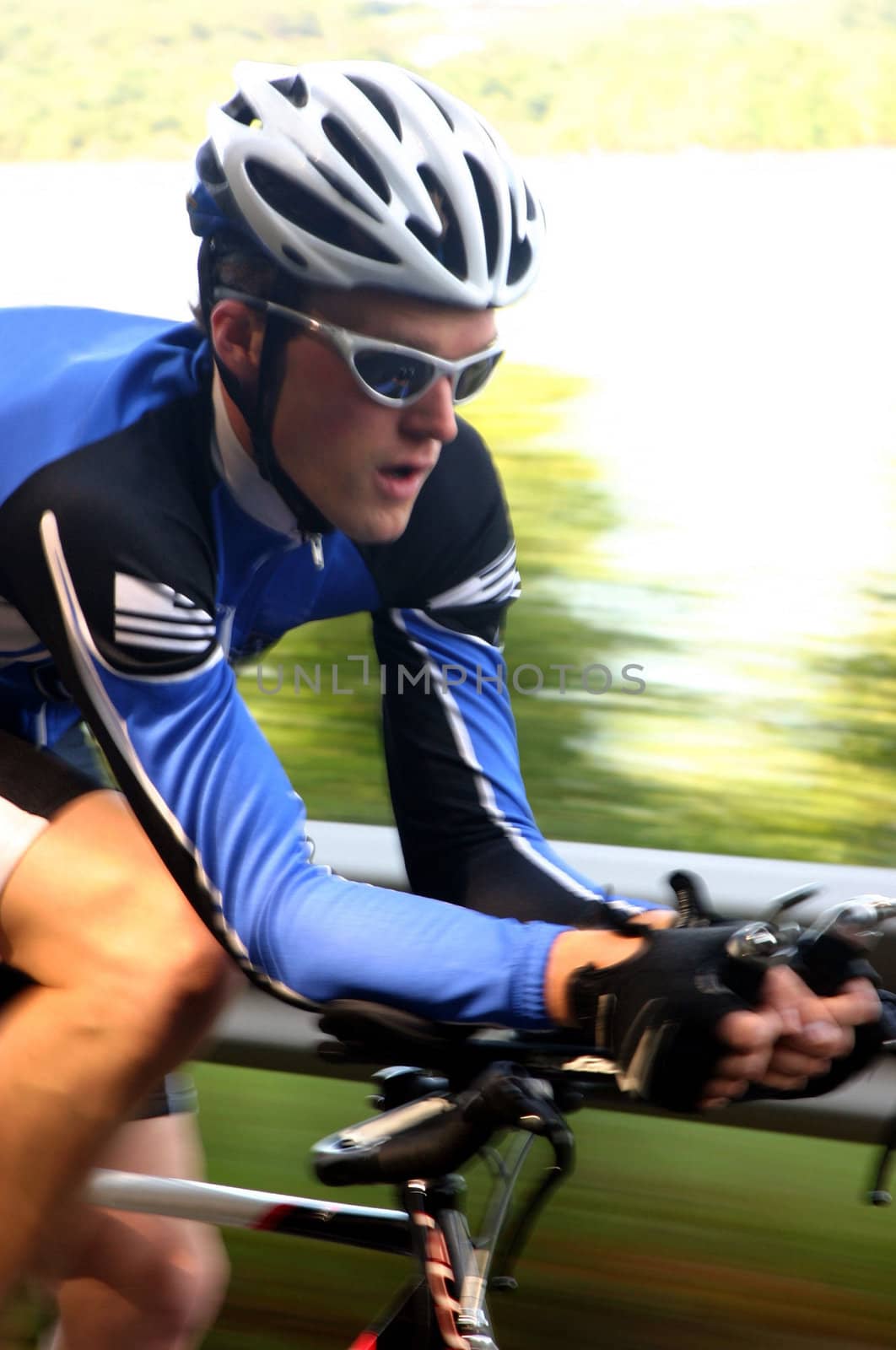 A fast image of a cyclist on a time trial/triathlon road bike