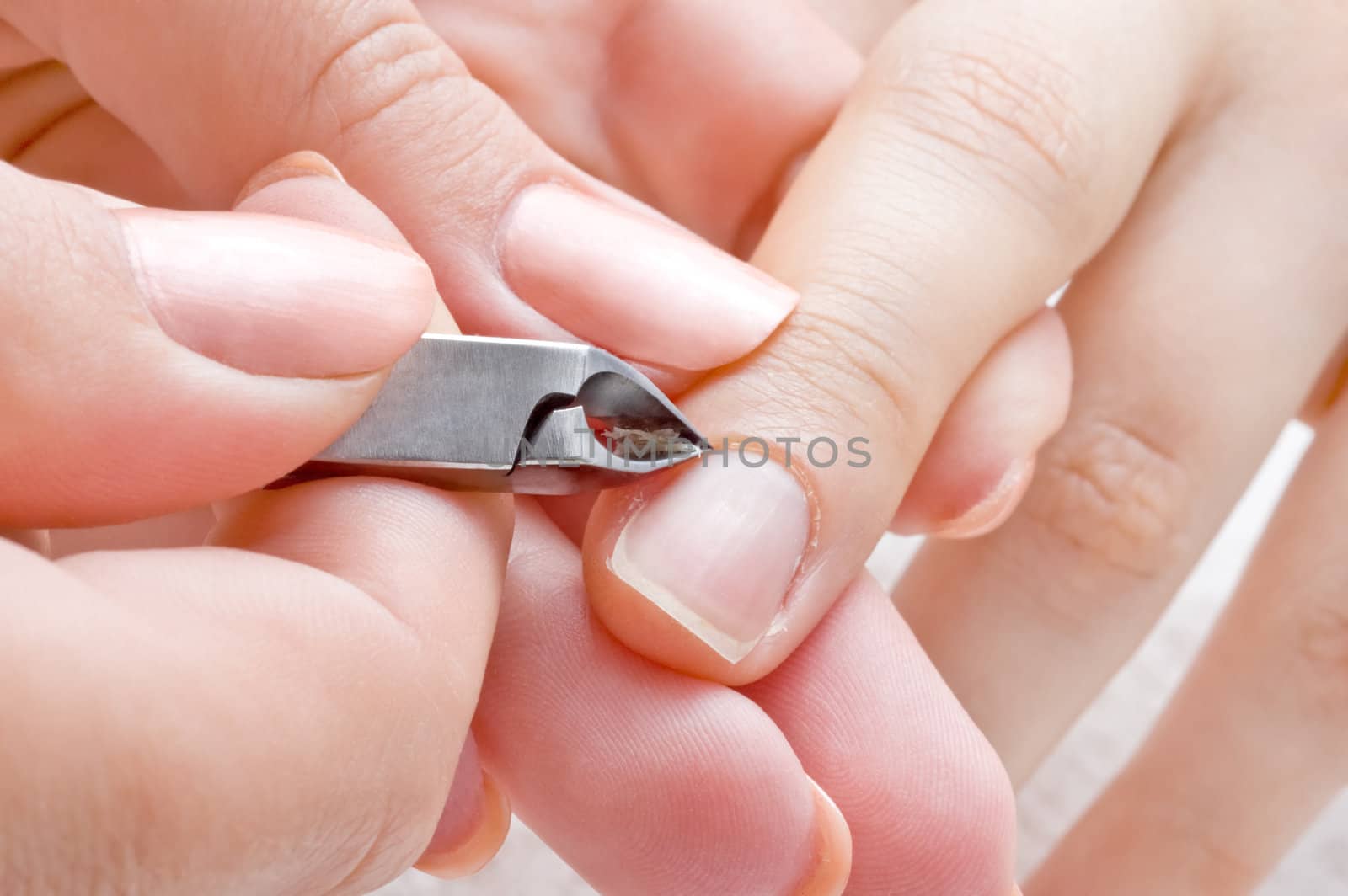 nail salon, manicure applying  - cuticle cut using special scissors