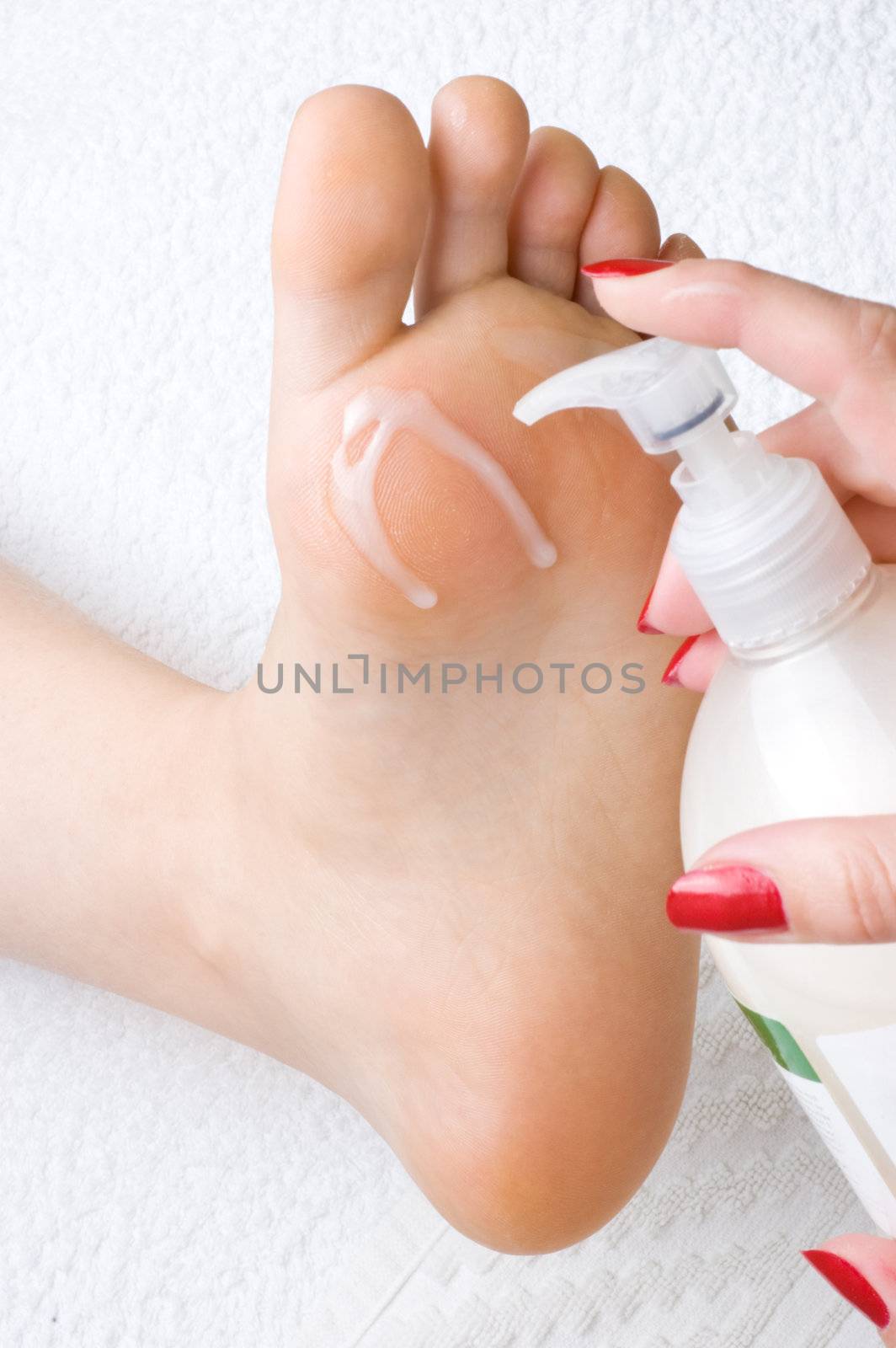 pedicure, applying the cream to soften and moisturize