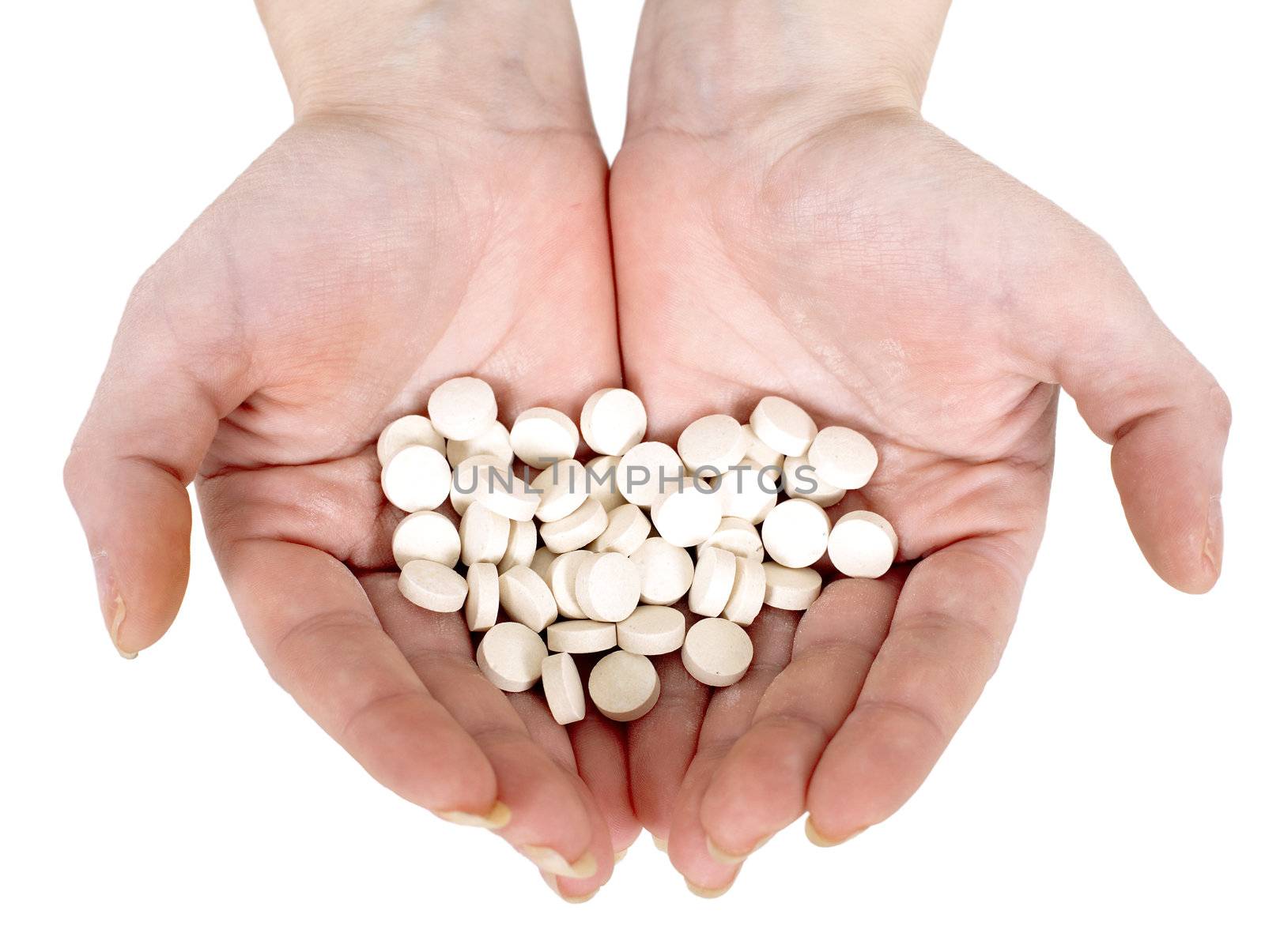 Handful of tablets on a white background