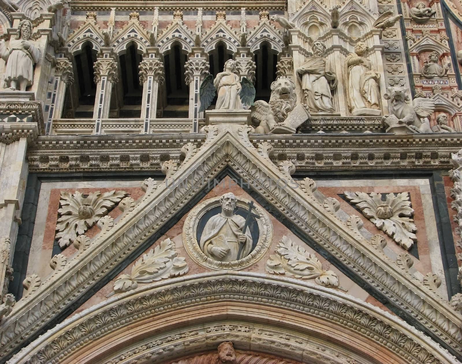 Carvings and statues on the exterior of the Duomo in Siena, Italy.
