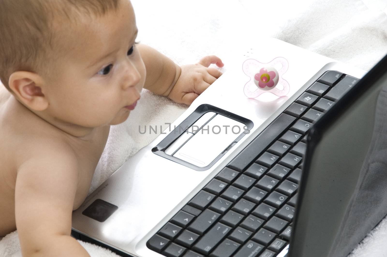 baby with laptop isolated on white background