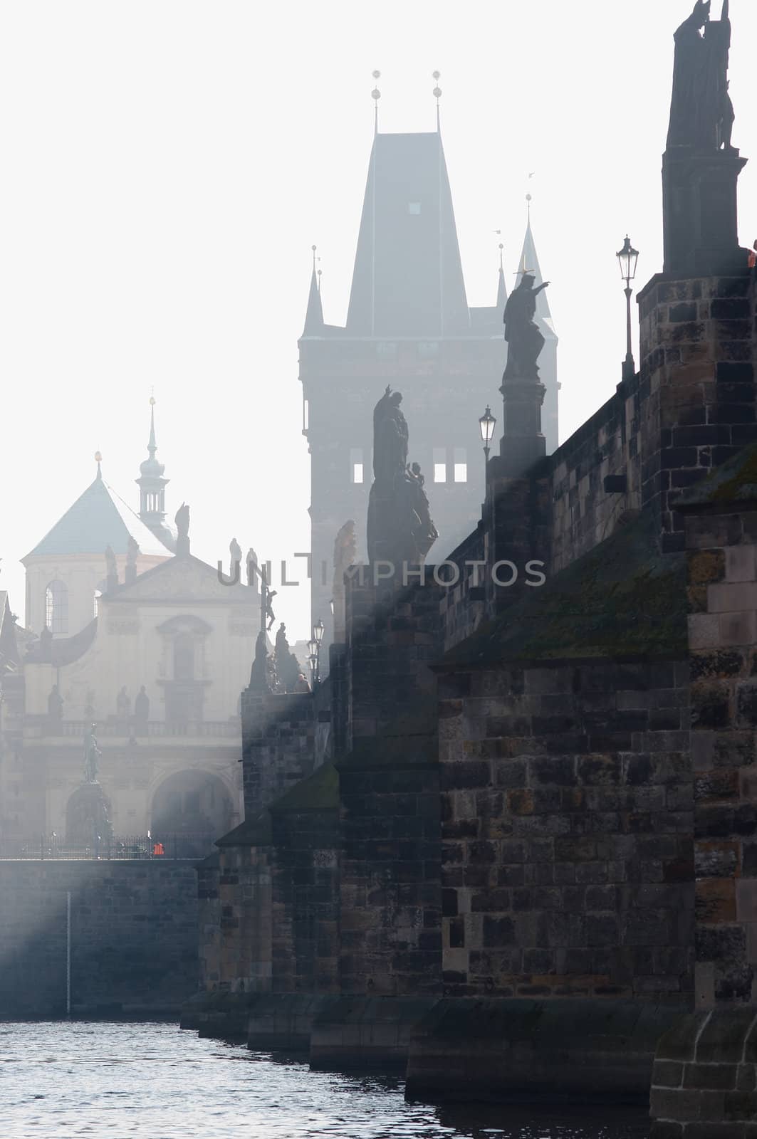 Charles bridge in the early morning fog by Mibuch