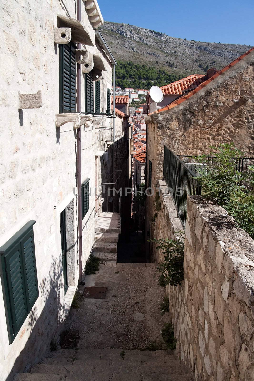 An old stairway leading down a alleyway