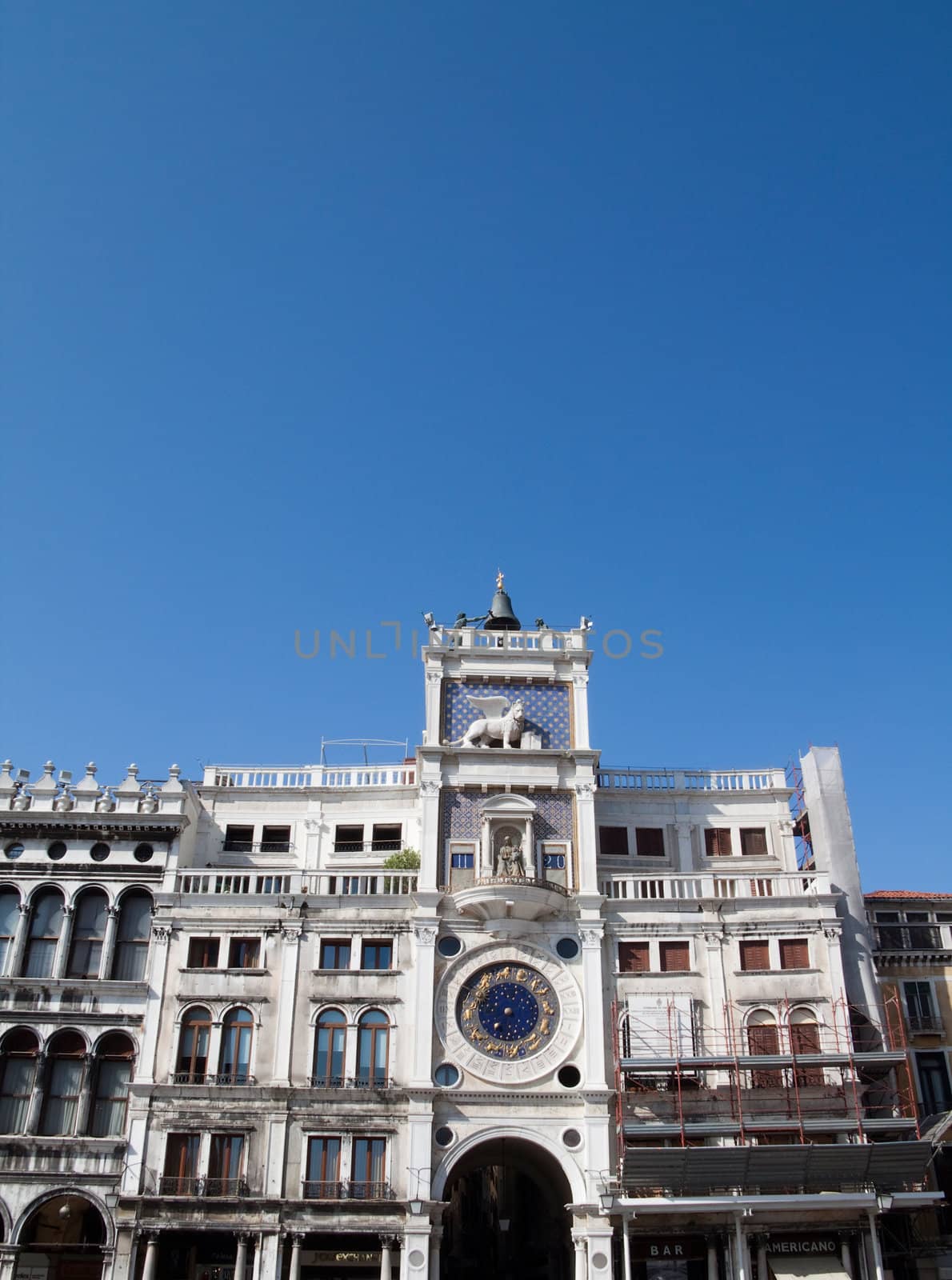 An old clock tower building in Venice, Italy