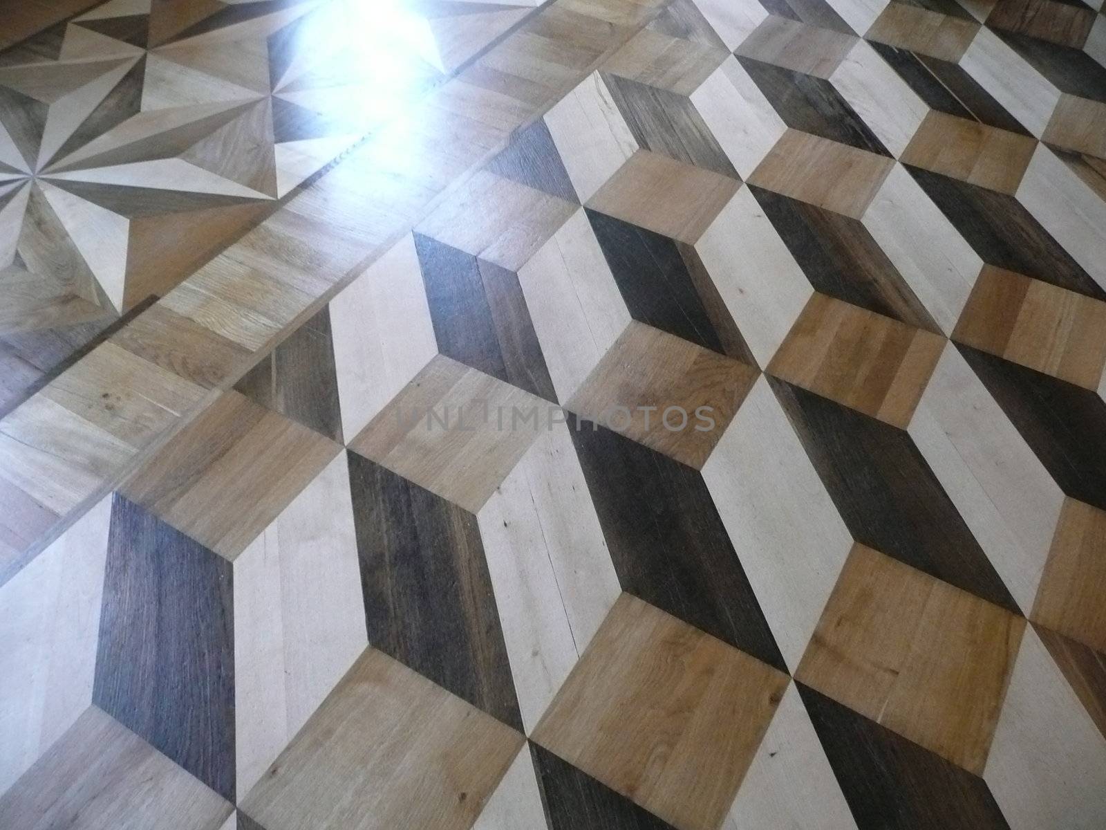 Amazing pattern of wood lats laid flat on the floor that gives an illusion of depth.