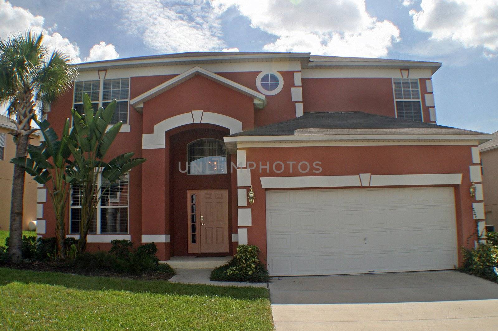 A front exterior of a large Florida home.
