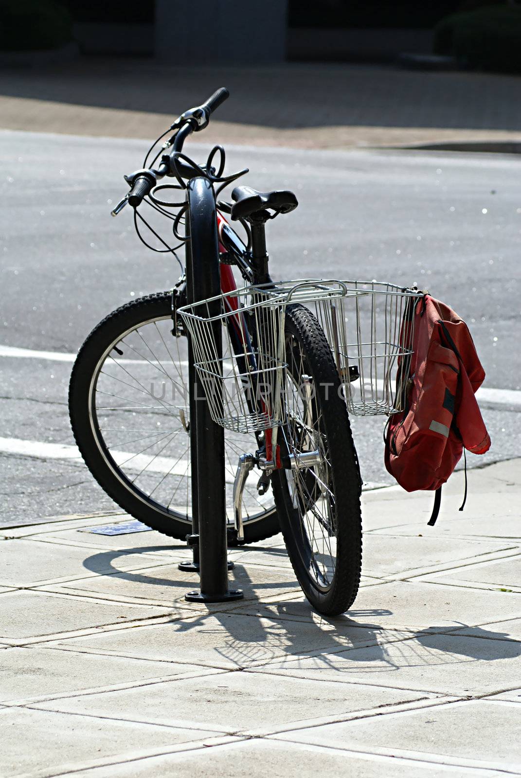 Bicycle parked in the city and locked.               