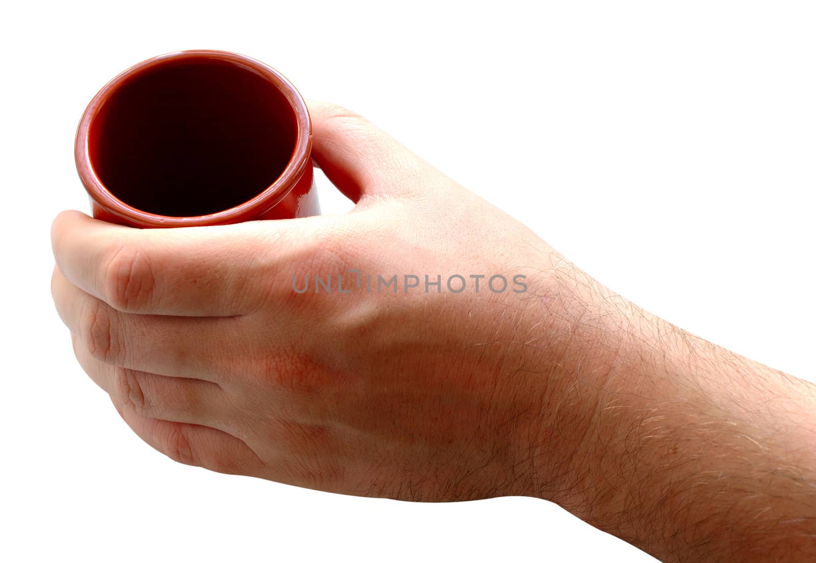 Pottery cup for tea or coffee in man's hand on isolated background.