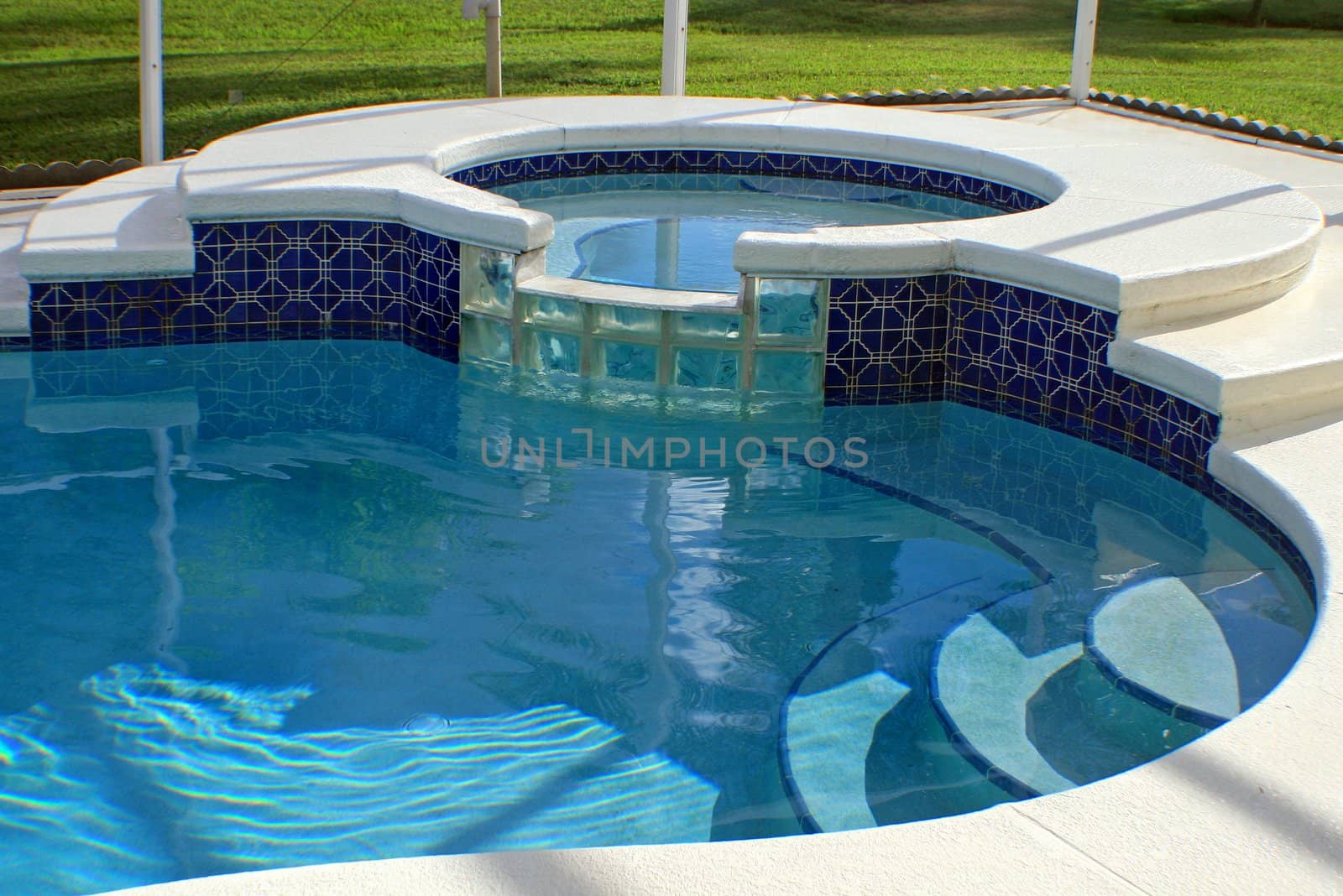 A luxurious swimming pool with a spa.
