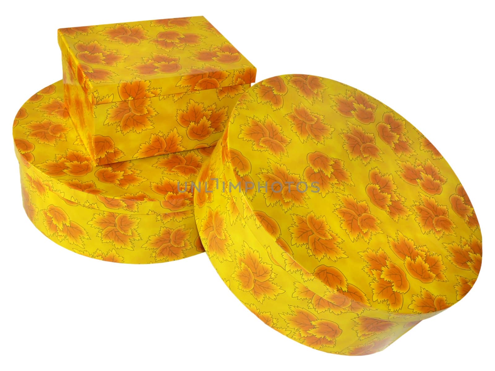 three yellow gift boxes with red leaves on white background