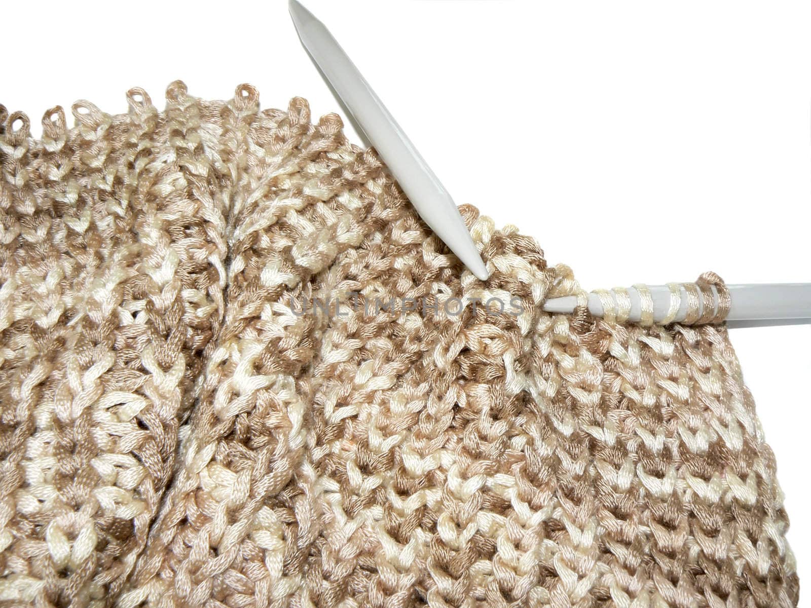 Knitting closeup isolated on white background