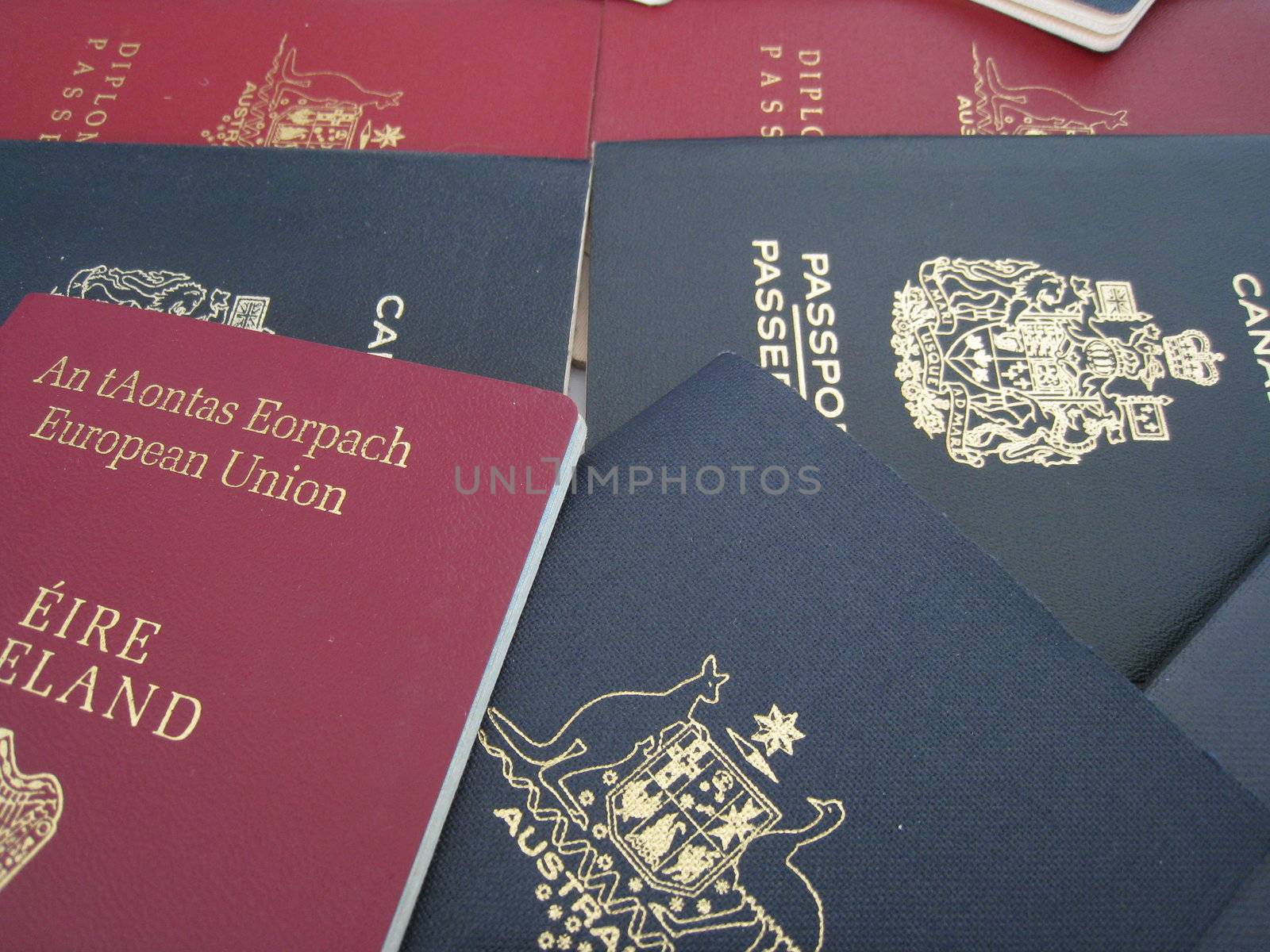 a selection of passports from Australia, Canada and Ireland